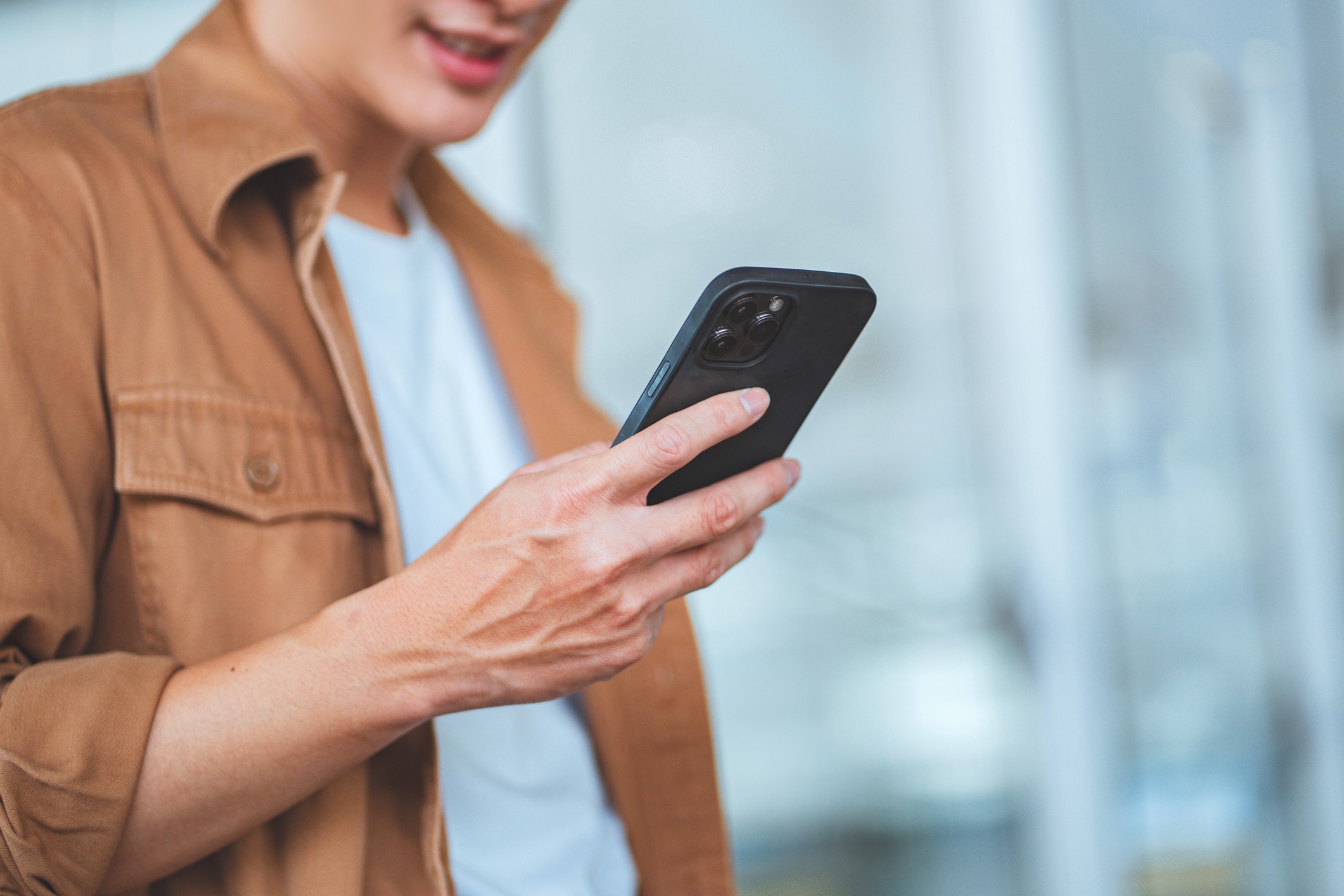 Young man checking his phone
