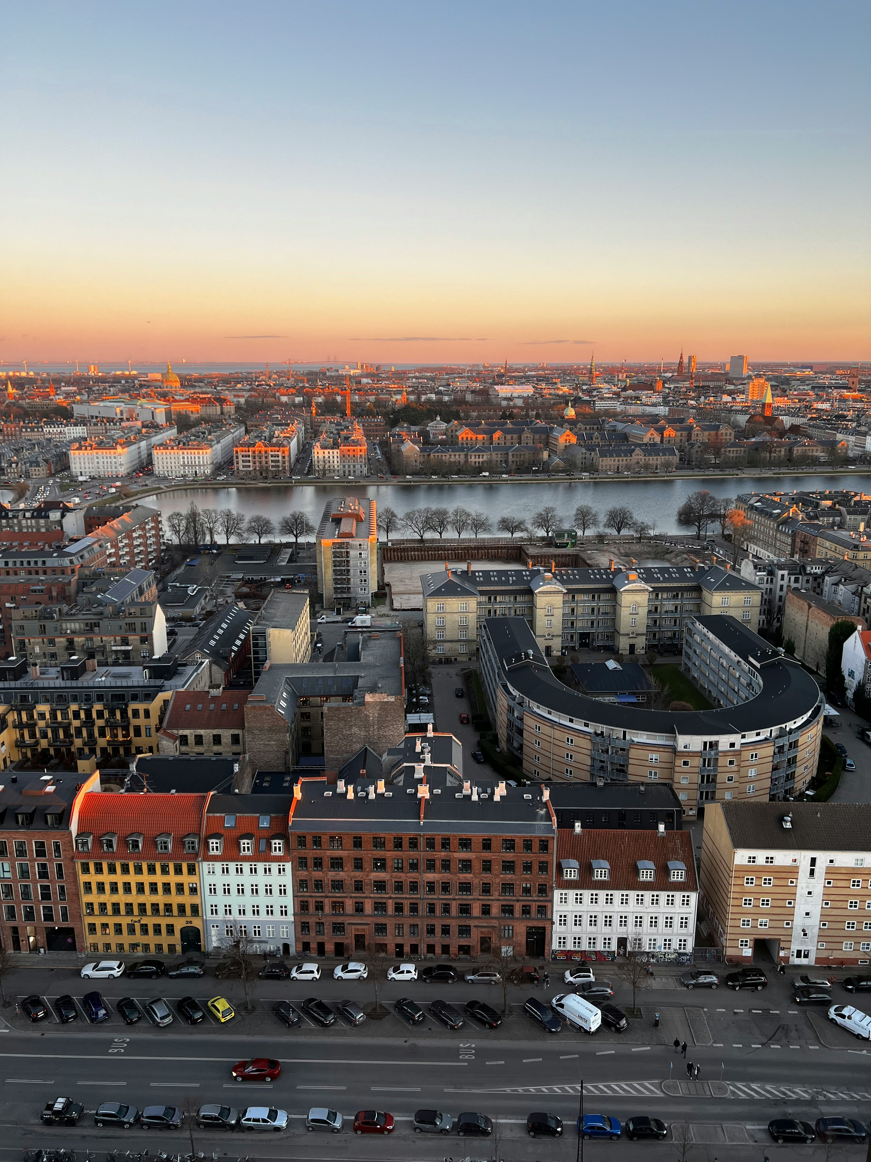 an aerial view of a city at sunset