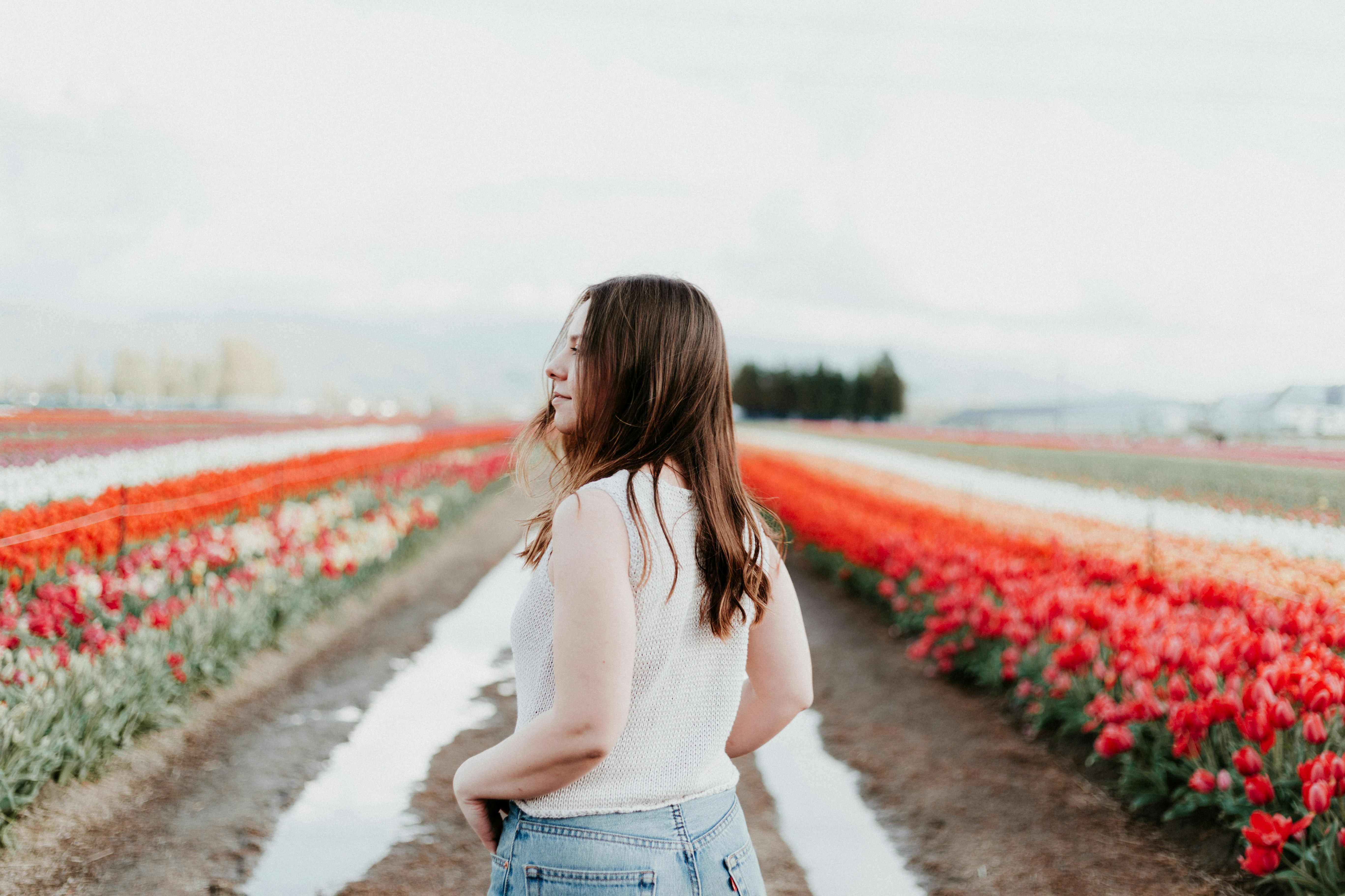 woman walking in a flower garden - Clear Spring Color Analysis