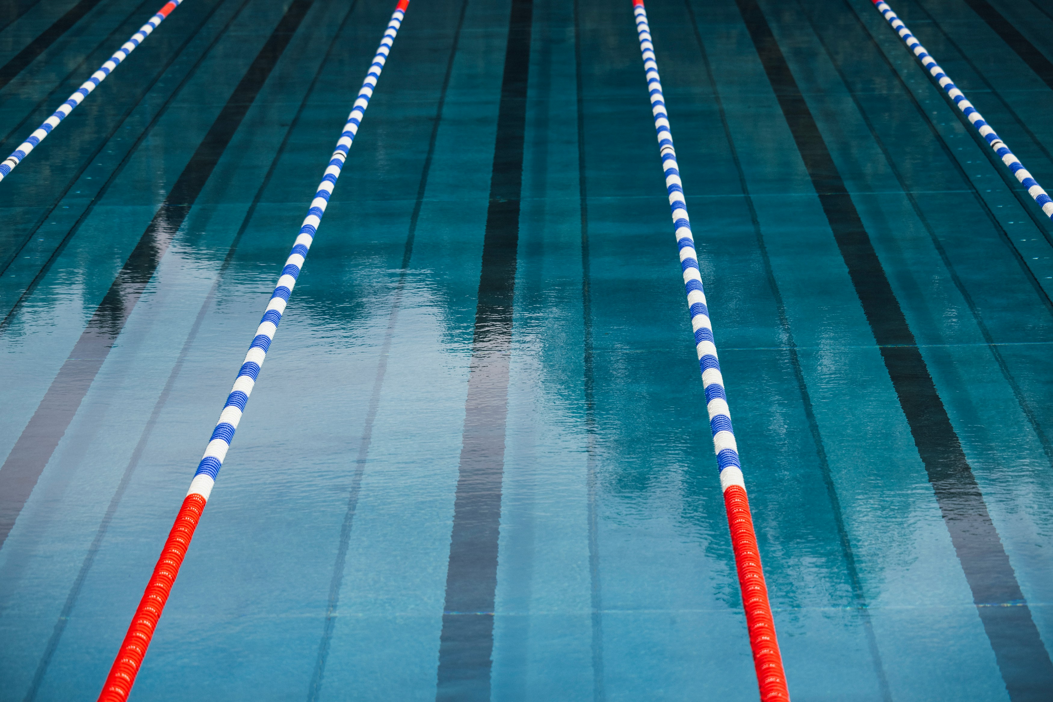 Empty lanes and lane ropes in a quiet indoor pool