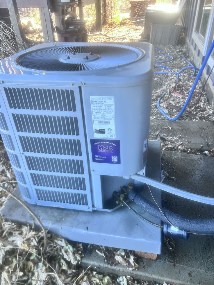 Brian and Hunter with MoJo Home Service truck in the background
