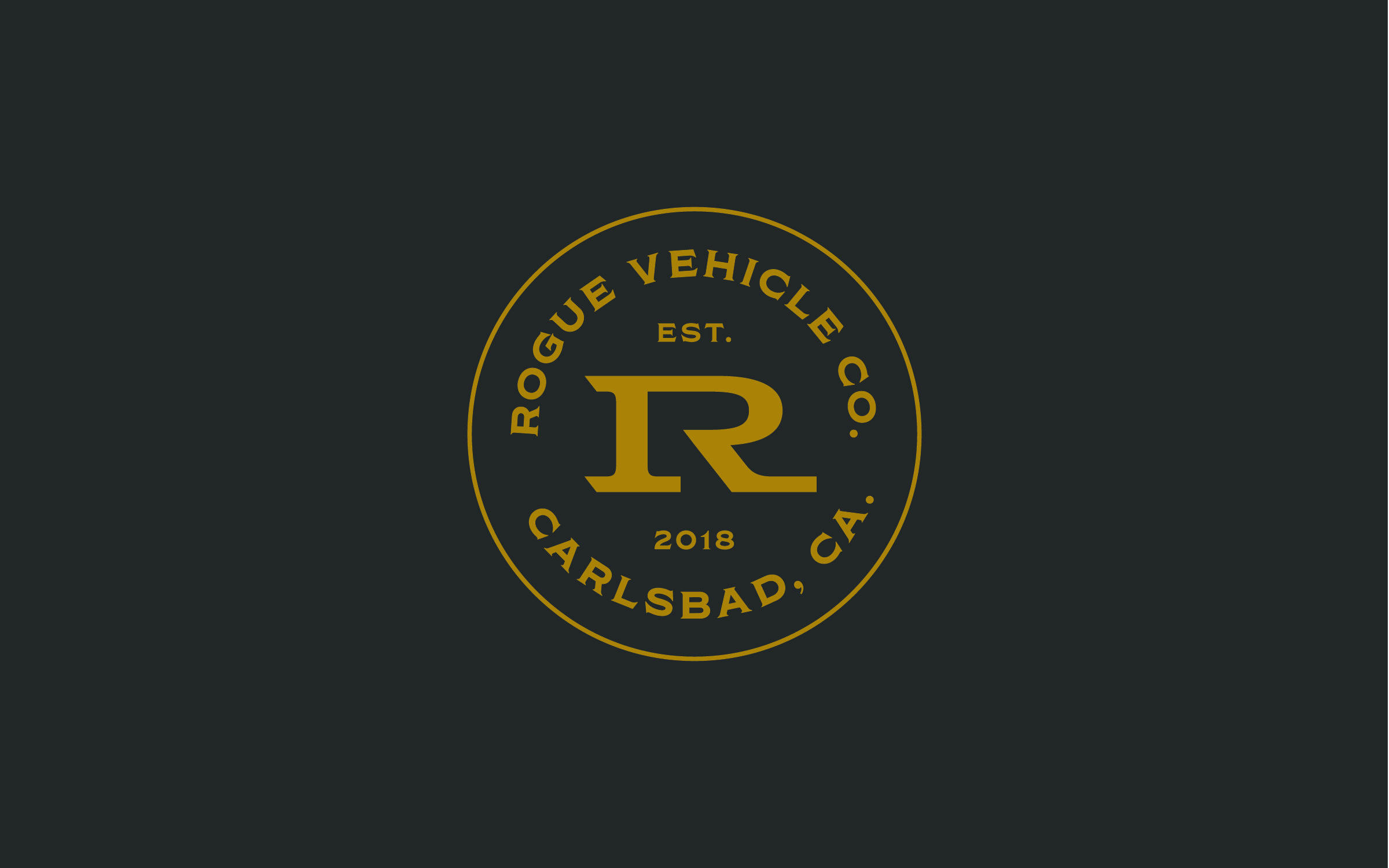 Rogue Vehicle Company circular badge logo in gold on dark background