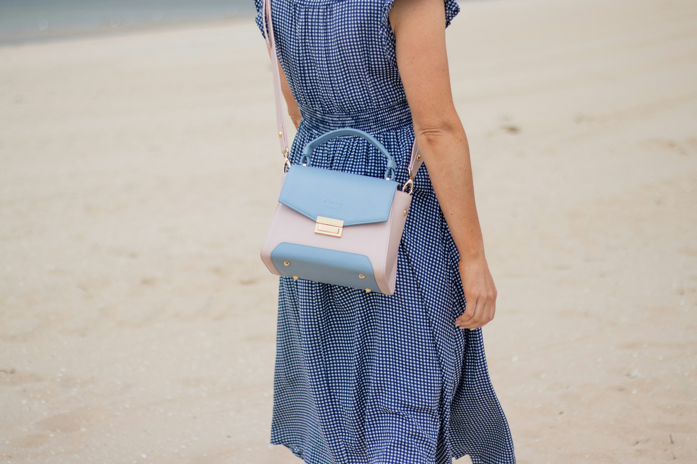 woman walking on beach - Colors That Go With Dark Blue