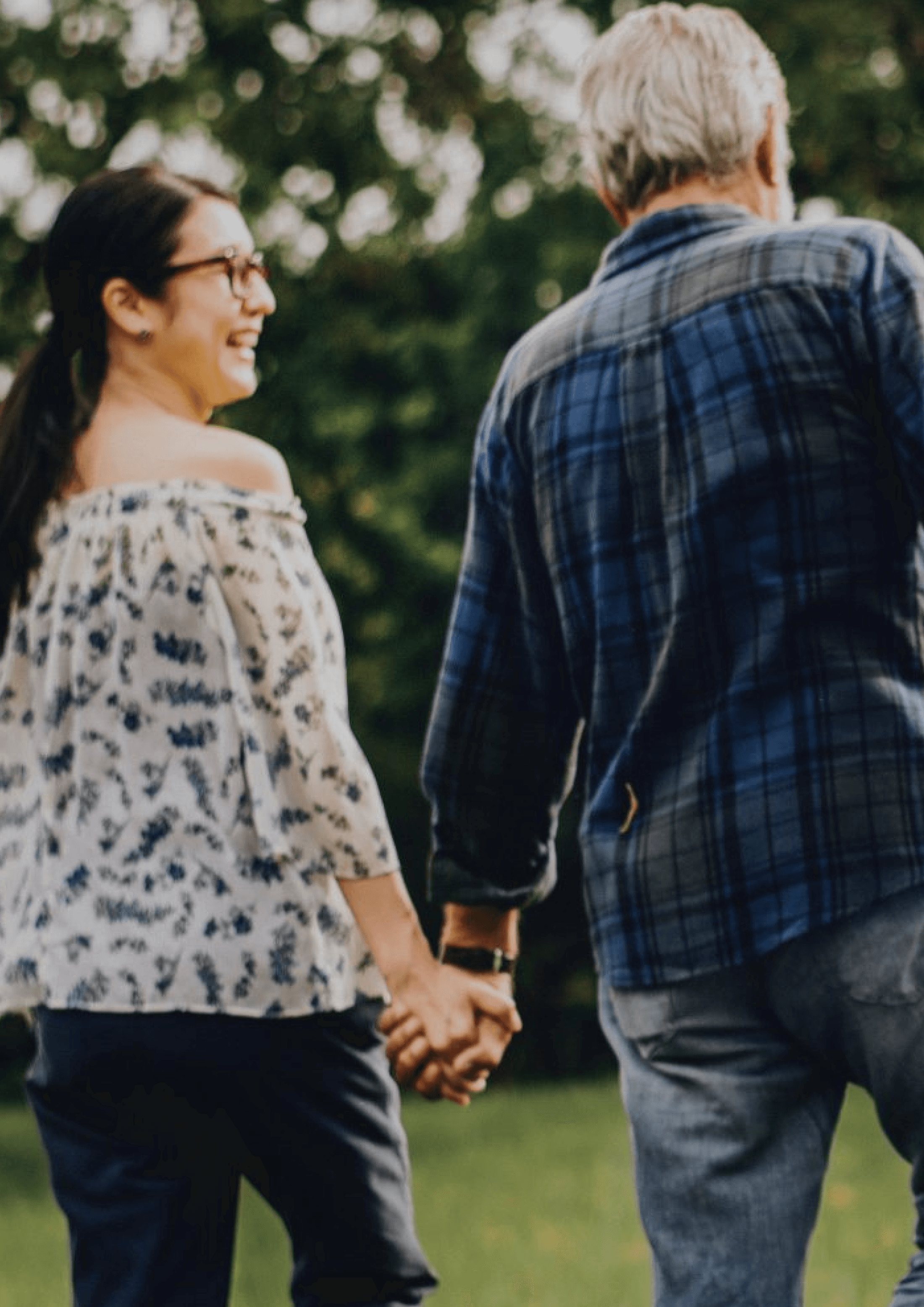 Happy couple walking in the park