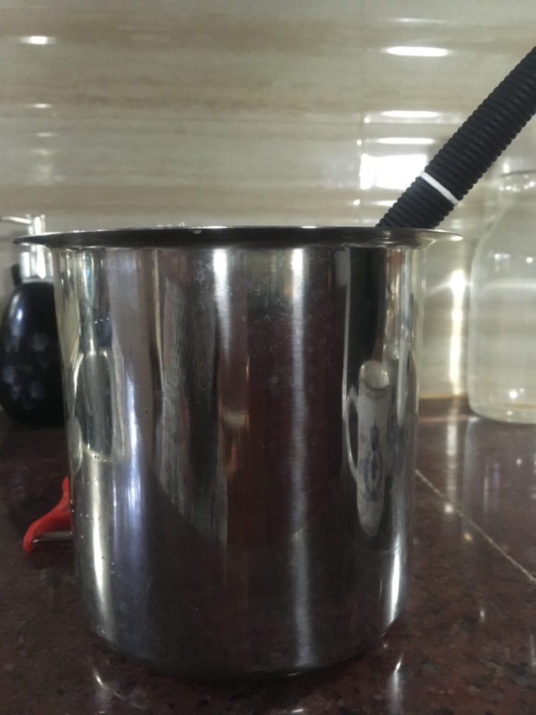 A deep vessel known as 'gunj' in Marathi. Ideal for churning cream.