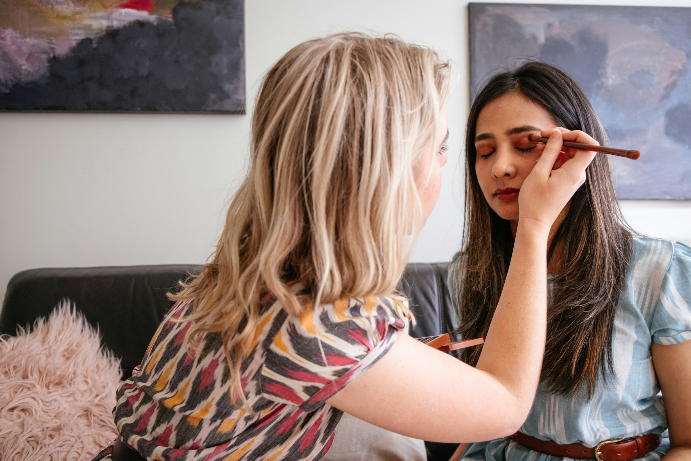 woman getting eye make up - Preppy Makeup