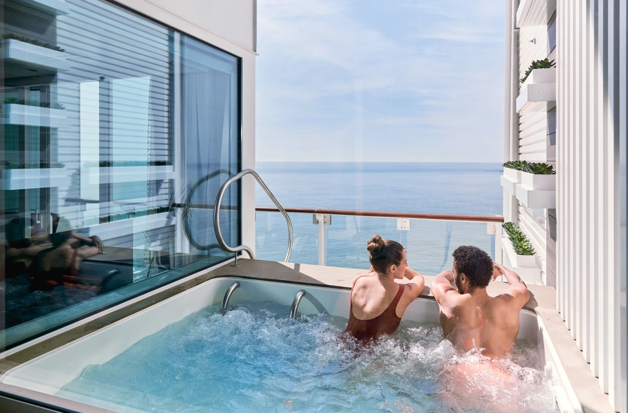 Two people in hot tub balcony 