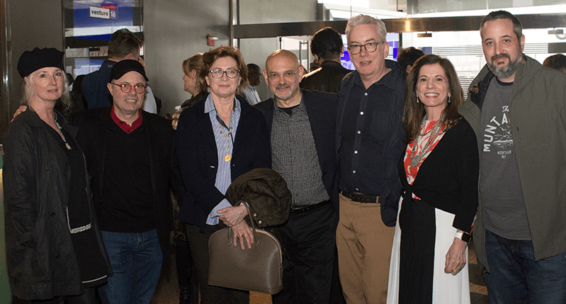 group photo of women and men at the exhibition gallery
