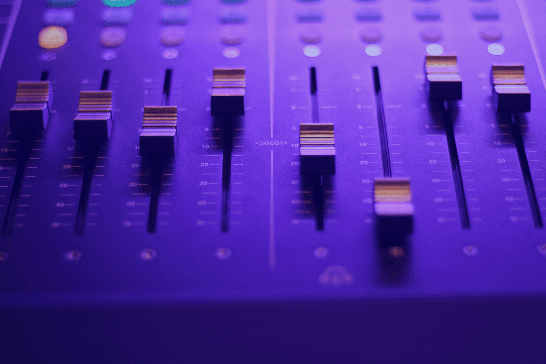 A close up photo of an audio mixer.