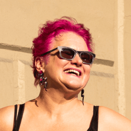 Possible member smiling and looking away from the camera.