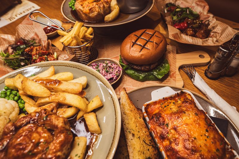 An assortment of food burger lasagne fris