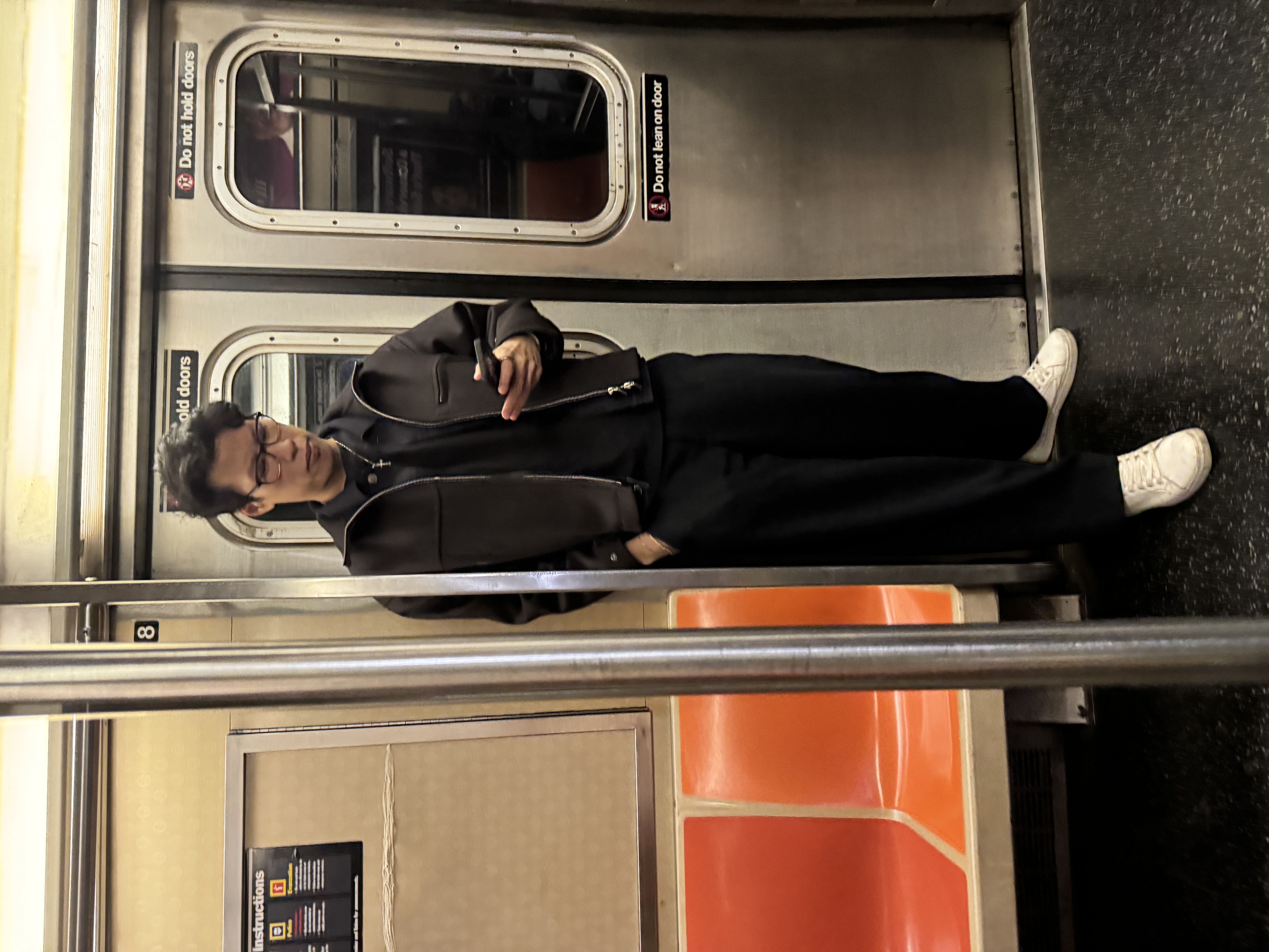 a blurry photo of a person standing in front of a wall