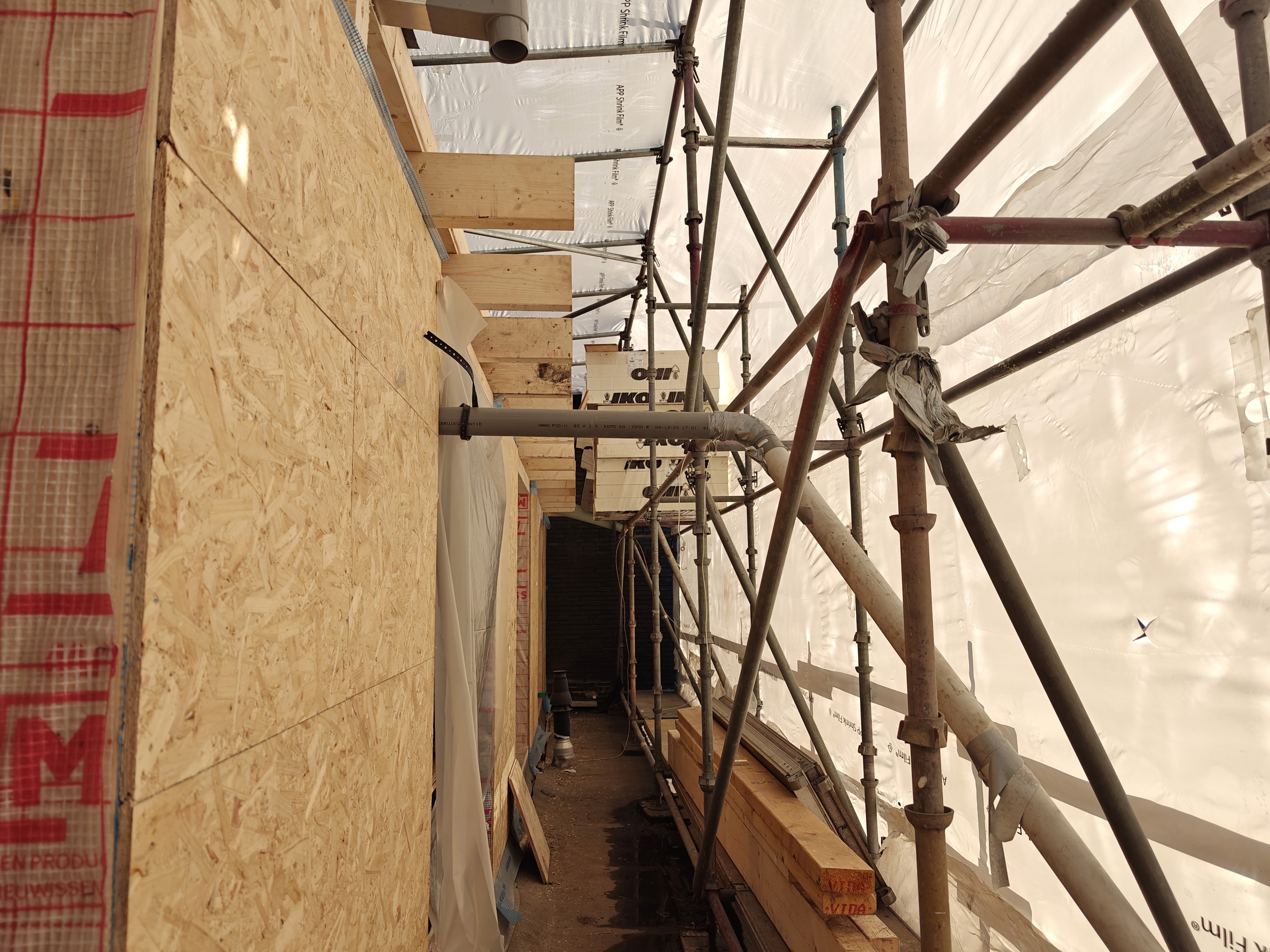 white wooden shelf near white wall