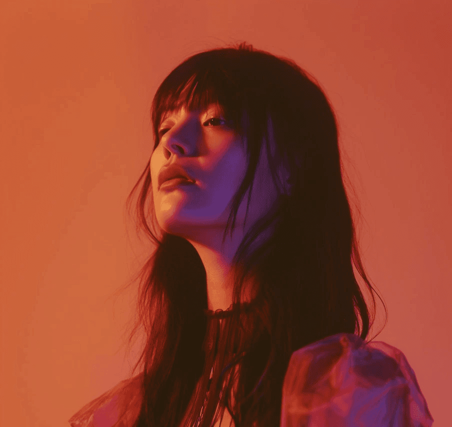 Asian woman in red light portrait