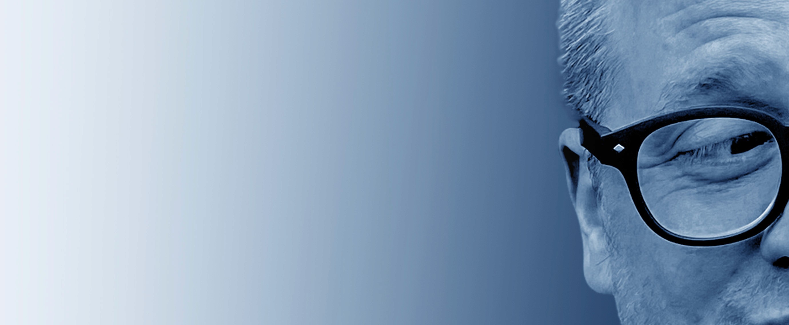 Grayscale close-up portrait of Jeremy J. McLean, Senior UX, Visual, and Motion Designer, featured in hero banner with gradient blue background.