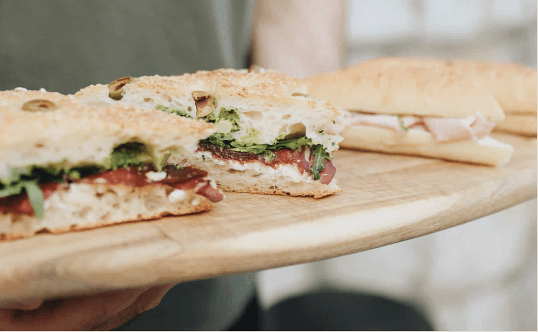 Artisan breakfast sandwich with pesto and cured meat at Jo & The Sisters Split