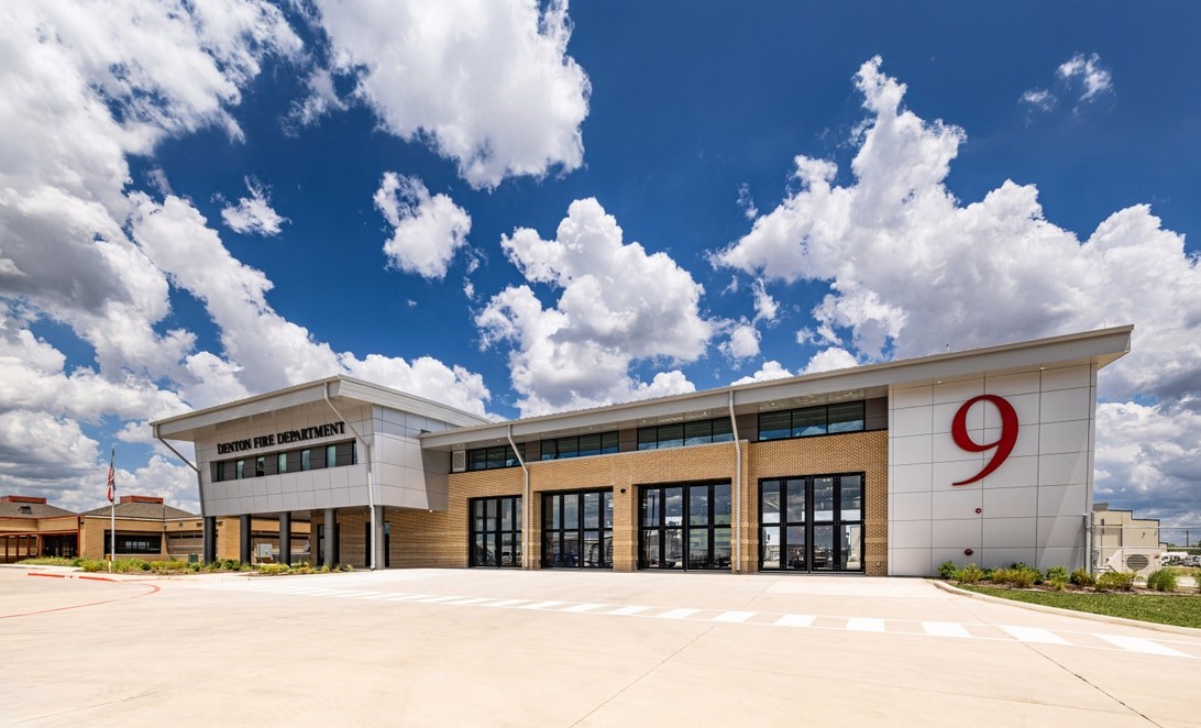 Front exterior of Denton Fire Station 9 with branded façade and large station number, by Martinez Architects
and Parkhill