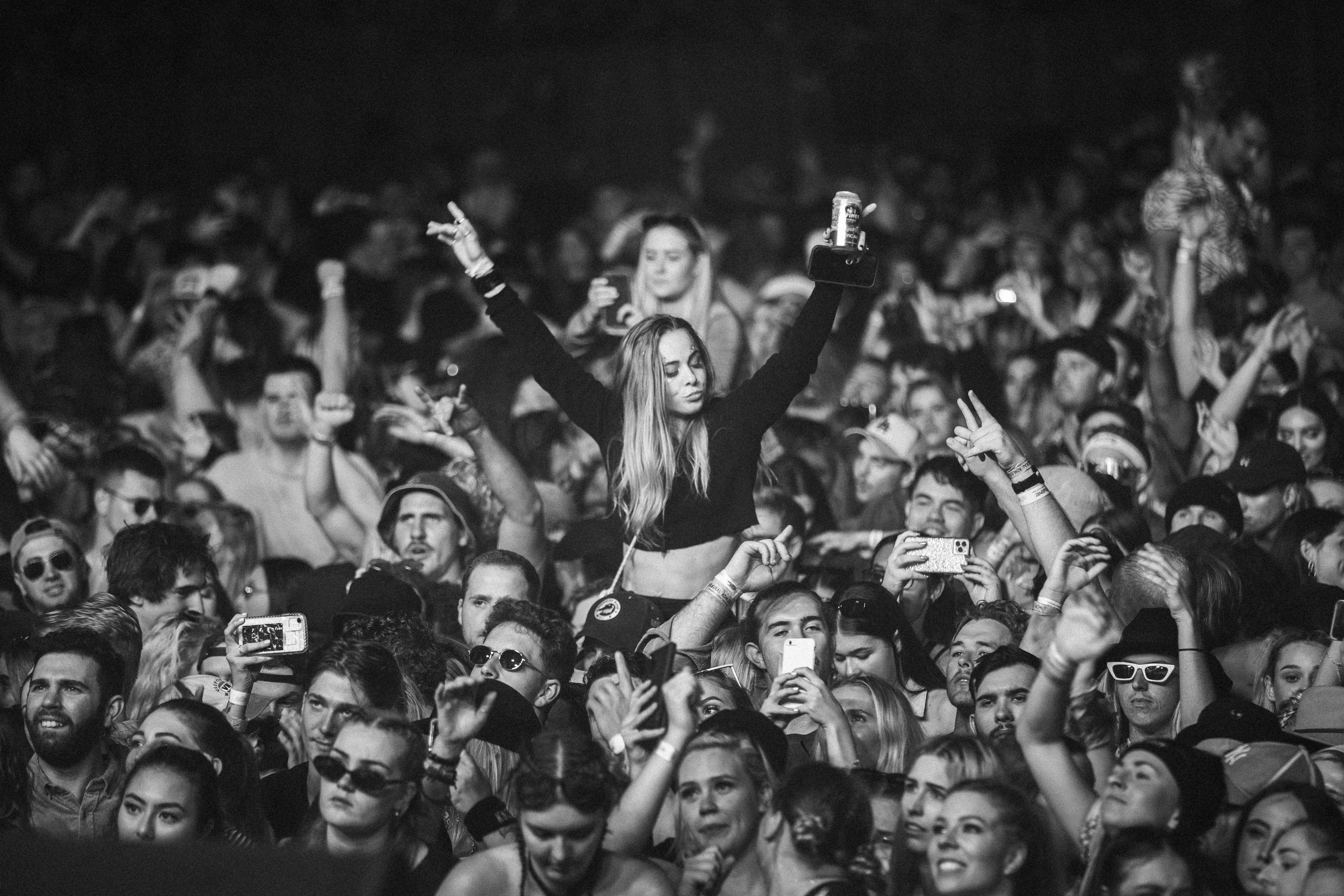 a woman standing in front of a crowd of people