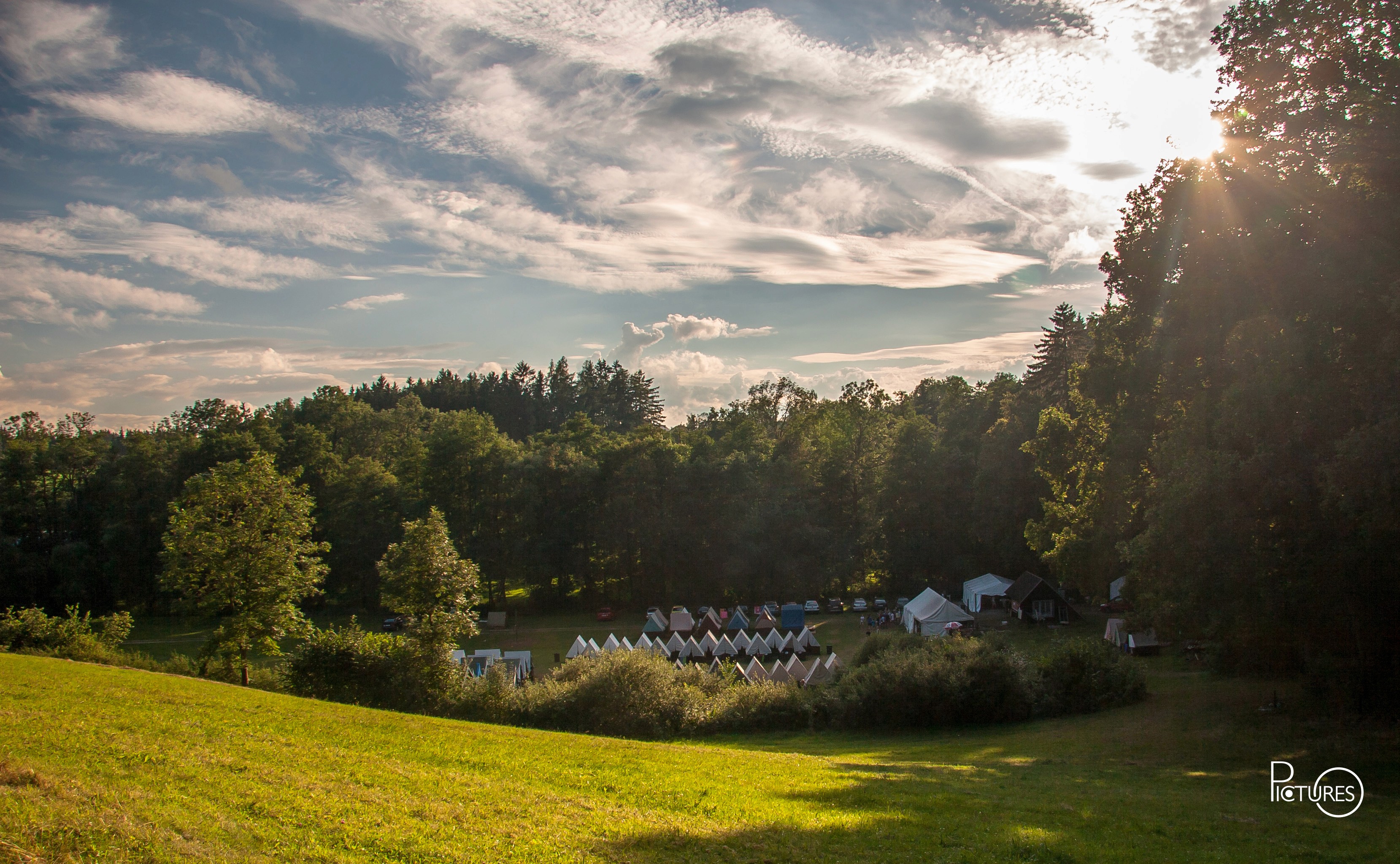 kids lying on a glass land and smiling