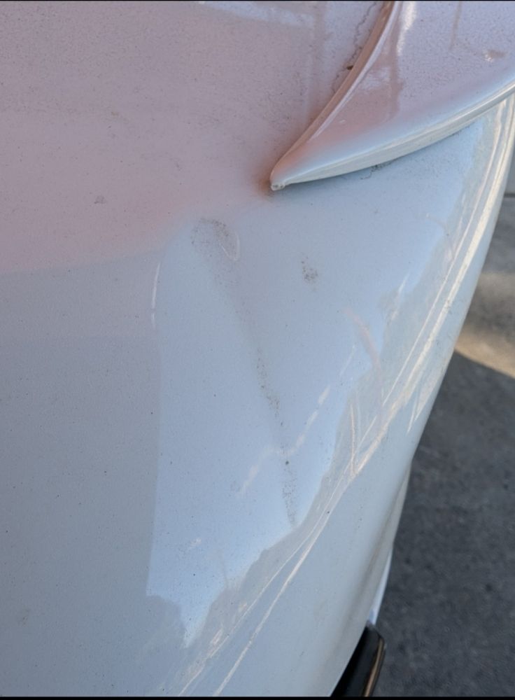 Cadillac CT4 trunk dent from a metal pole