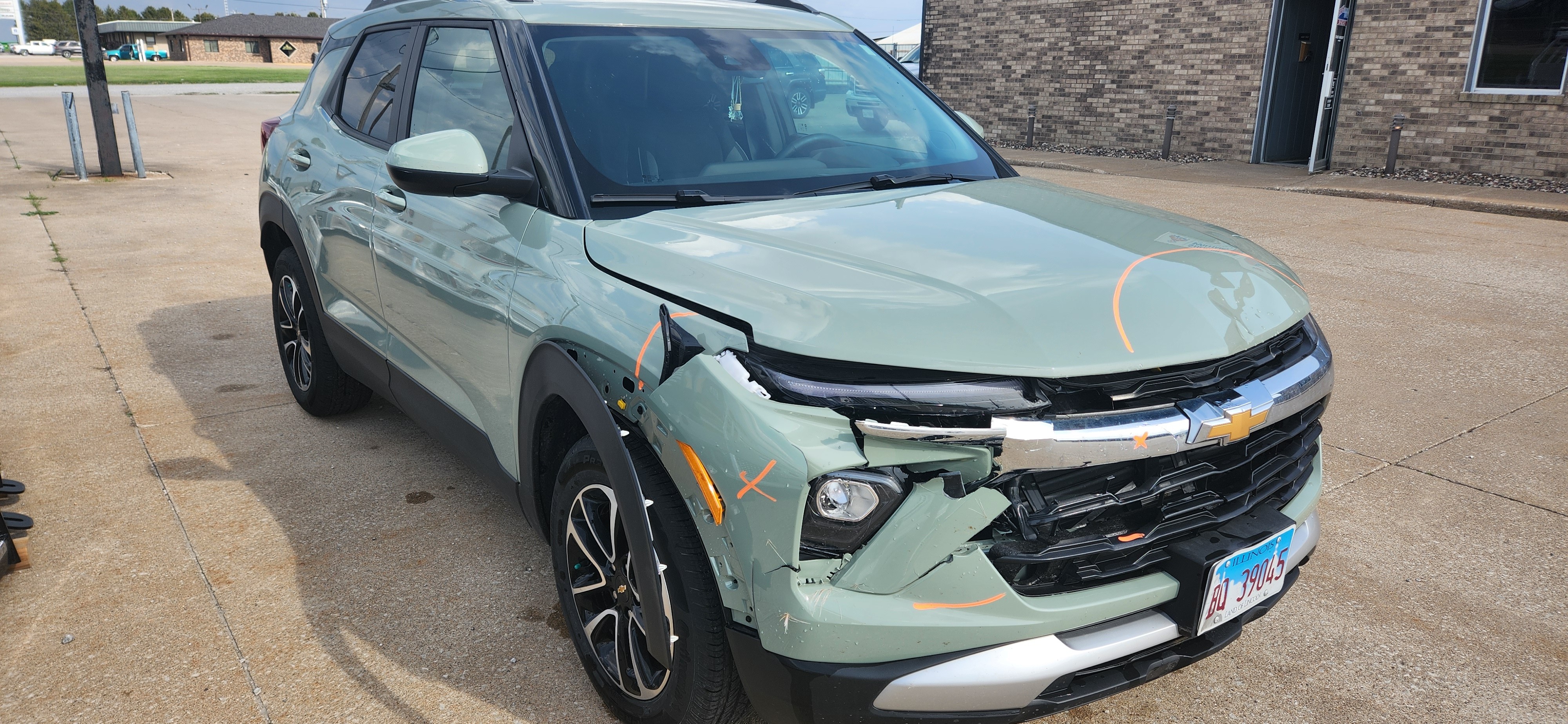 Car front end damaged by deer collision