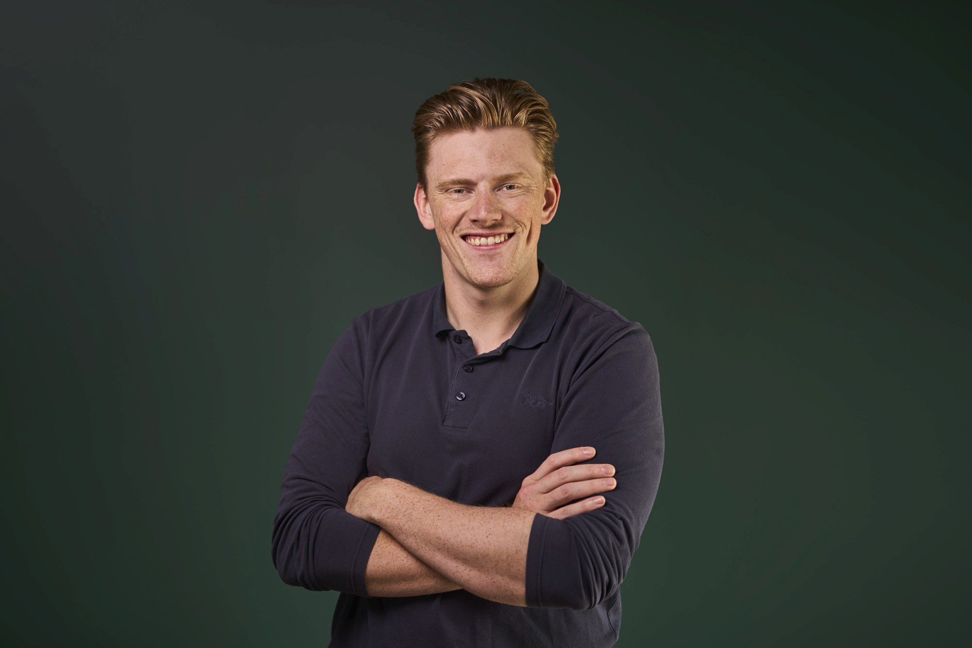 Close-up of a tree stump showing growth rings and a textured brown wood surface.