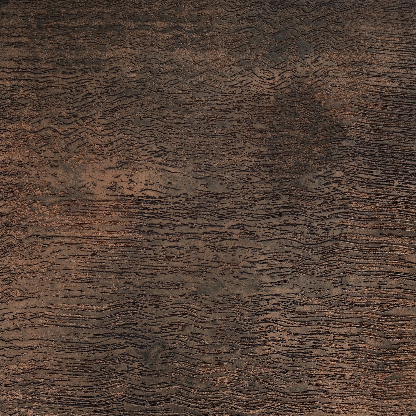 Weathered corten steel surface with a fine rippled patina