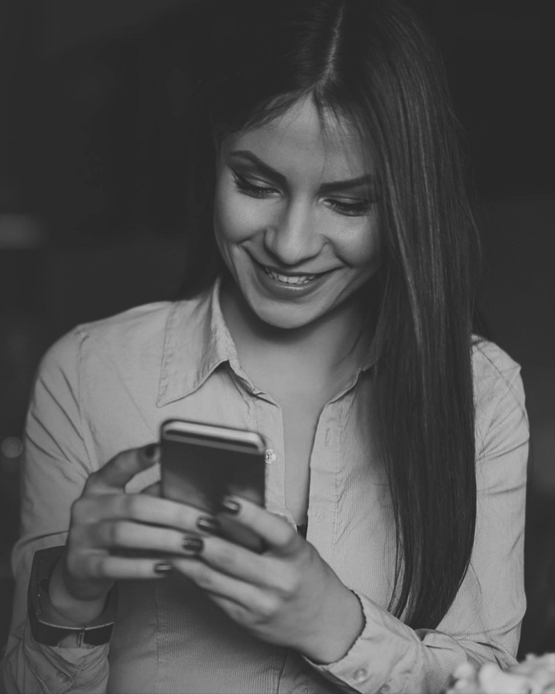 Visual for Growth Service. Person using a smartphone, representing mobile growth and user engagement.