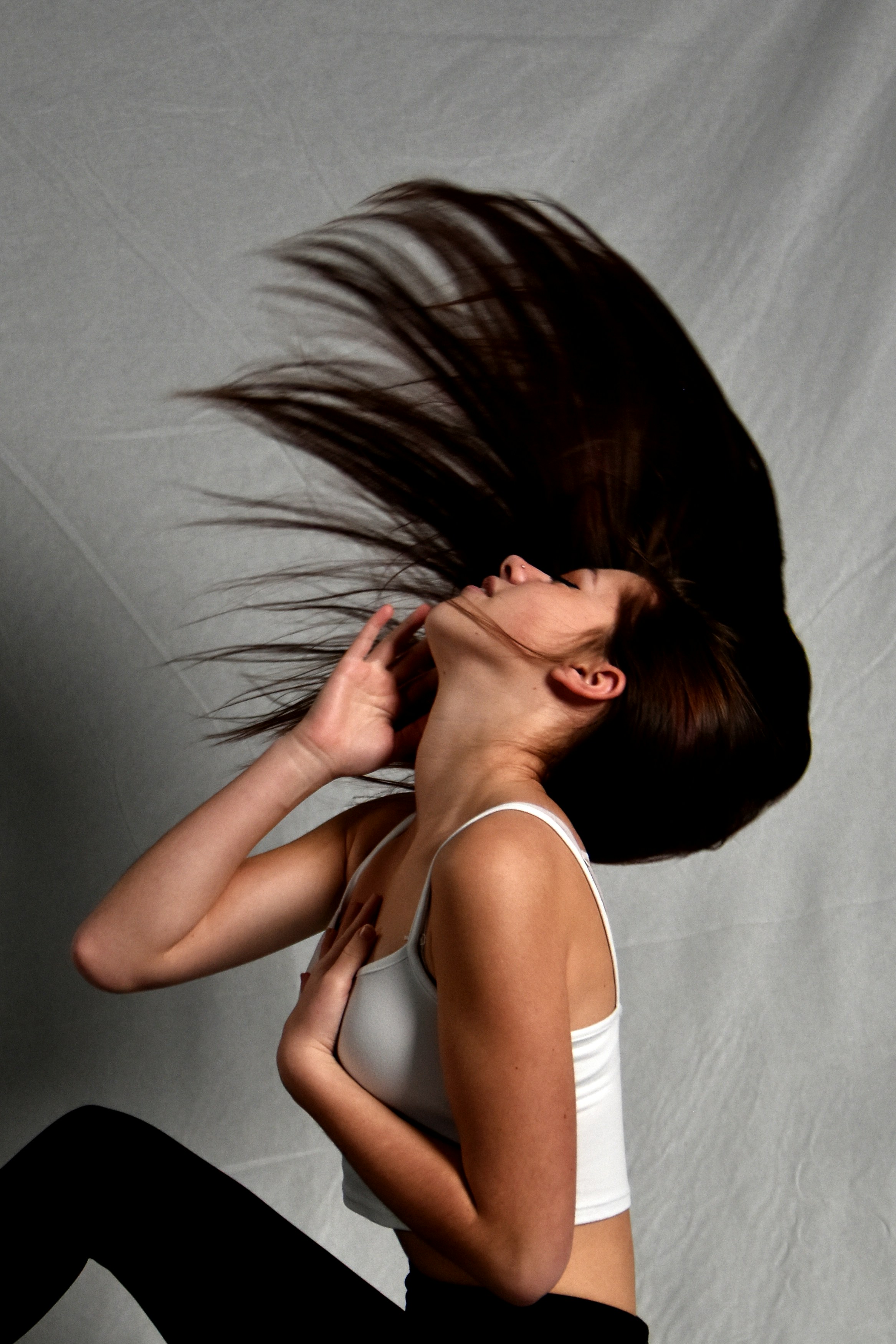 a woman with her hair blowing in the wind