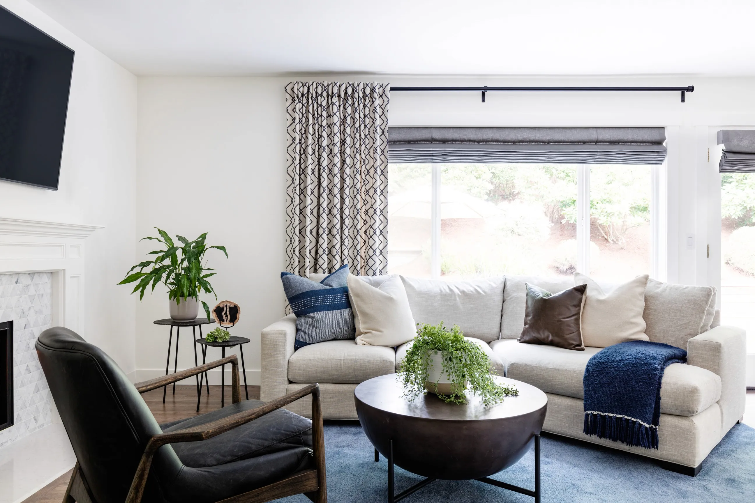 The living room and dining room of The Bothell House Remodel by interior design + professional organizing firm, Elegant Simplicity.