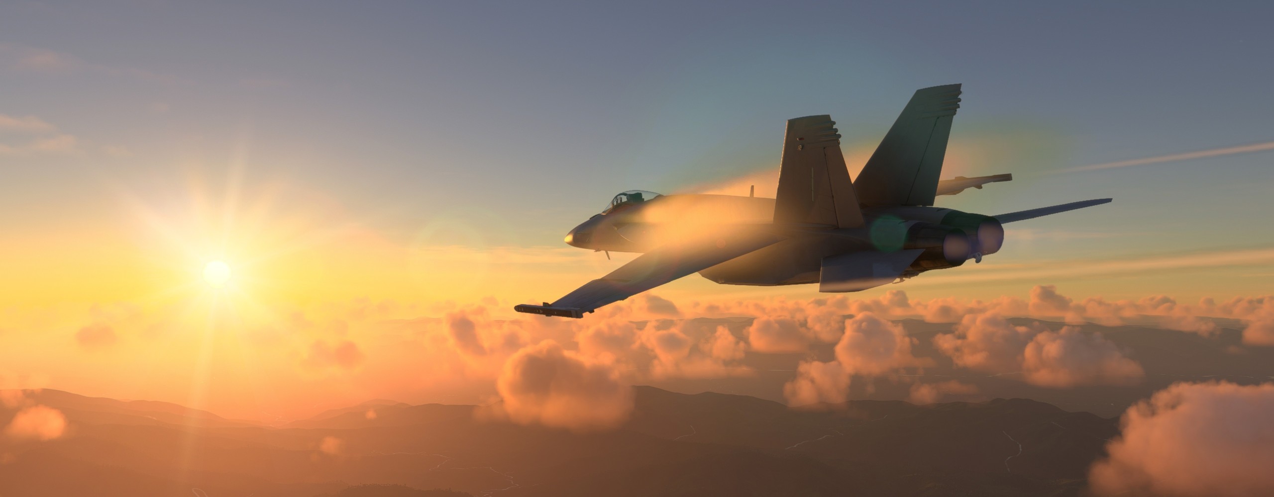 four boys laughing and sitting on grass during daytime