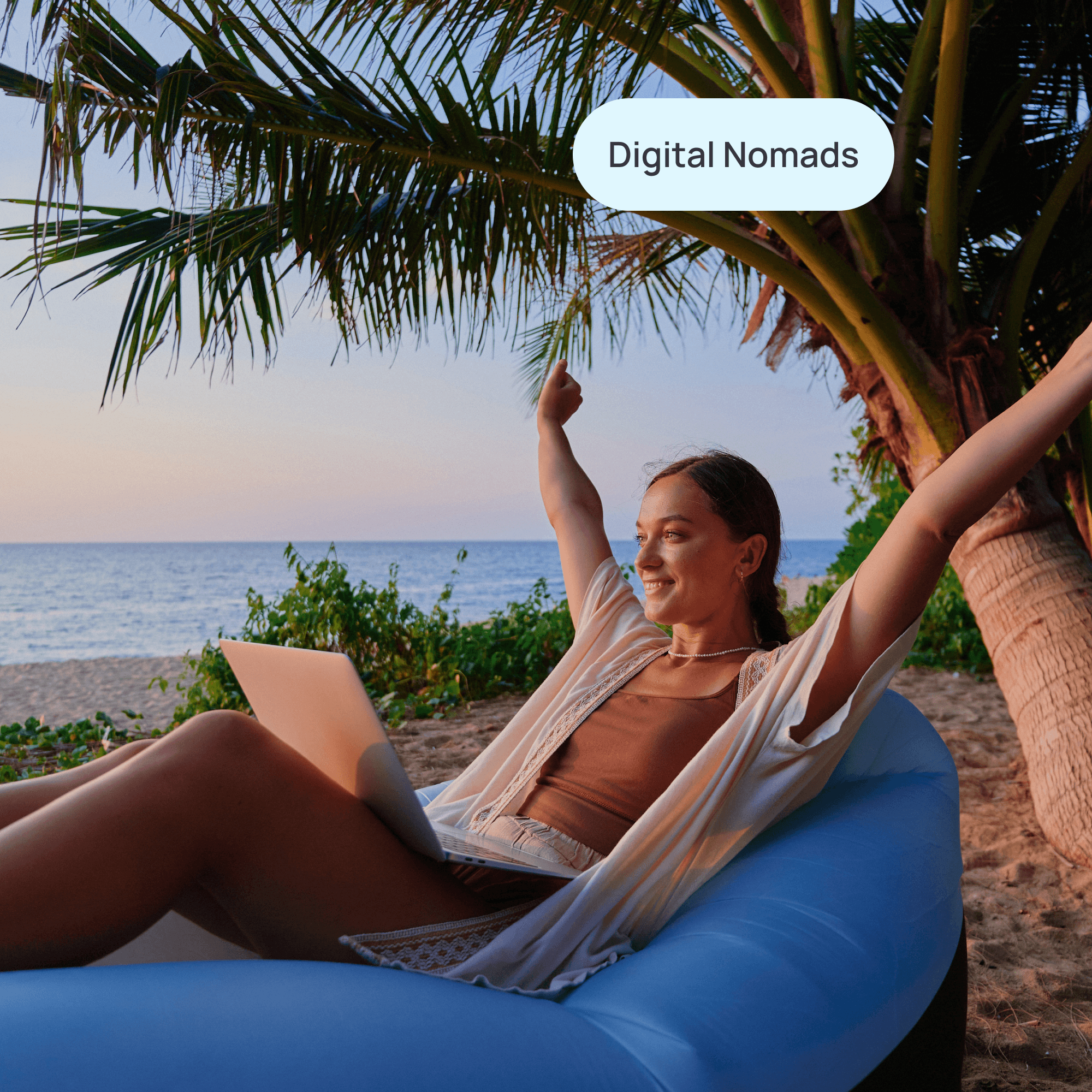 woman working on her laptop on the beach with label "digital nomads"