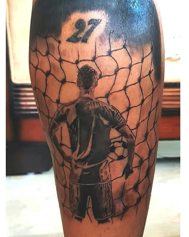 Football realism calf tattoo by a tattoo artist in Bangalore at Fred's tattoo studio Bangalore, featured among the best tattoo places in Bangalore.