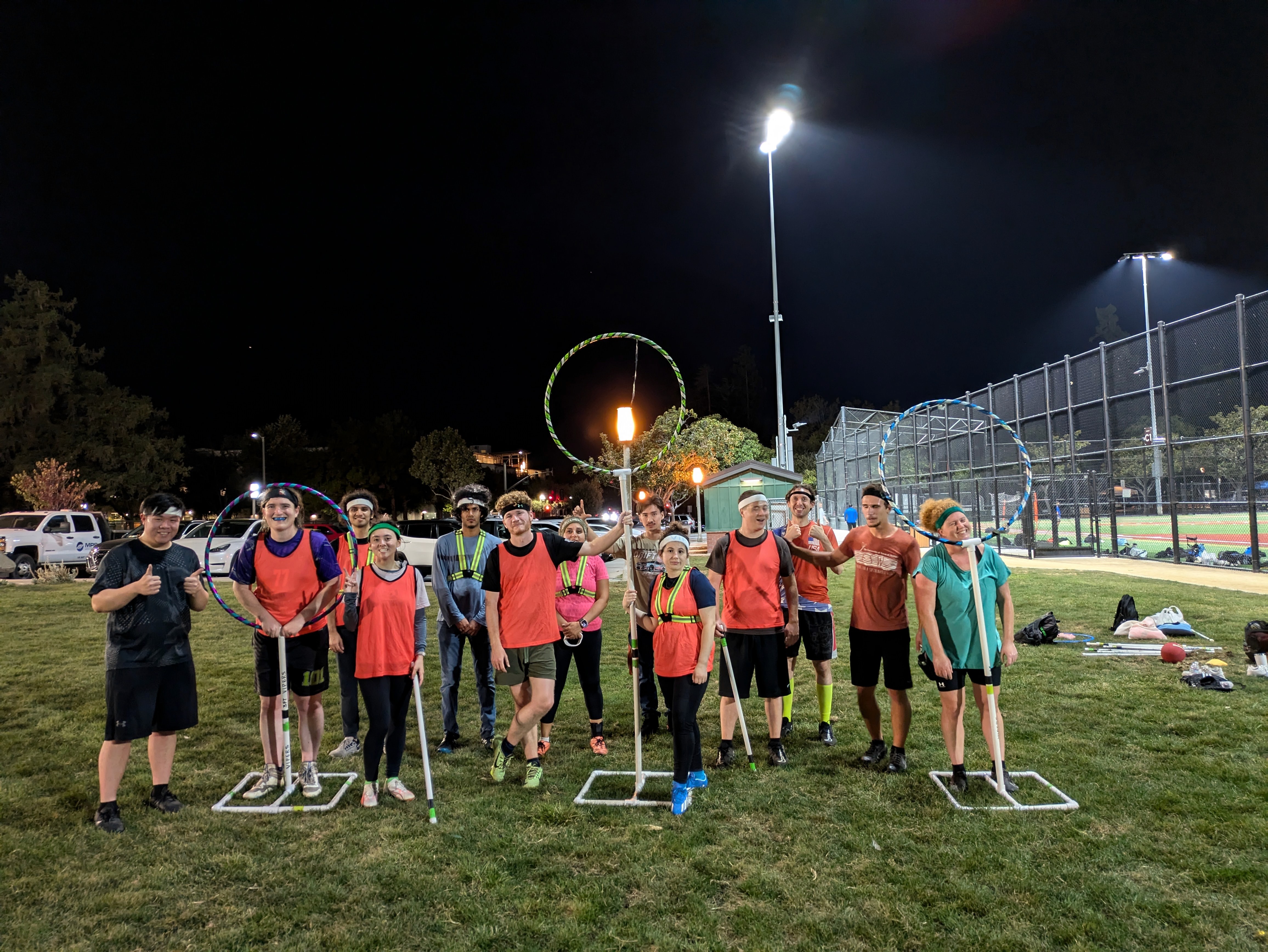 Group photo by the hoops after a Thursday evening practice 