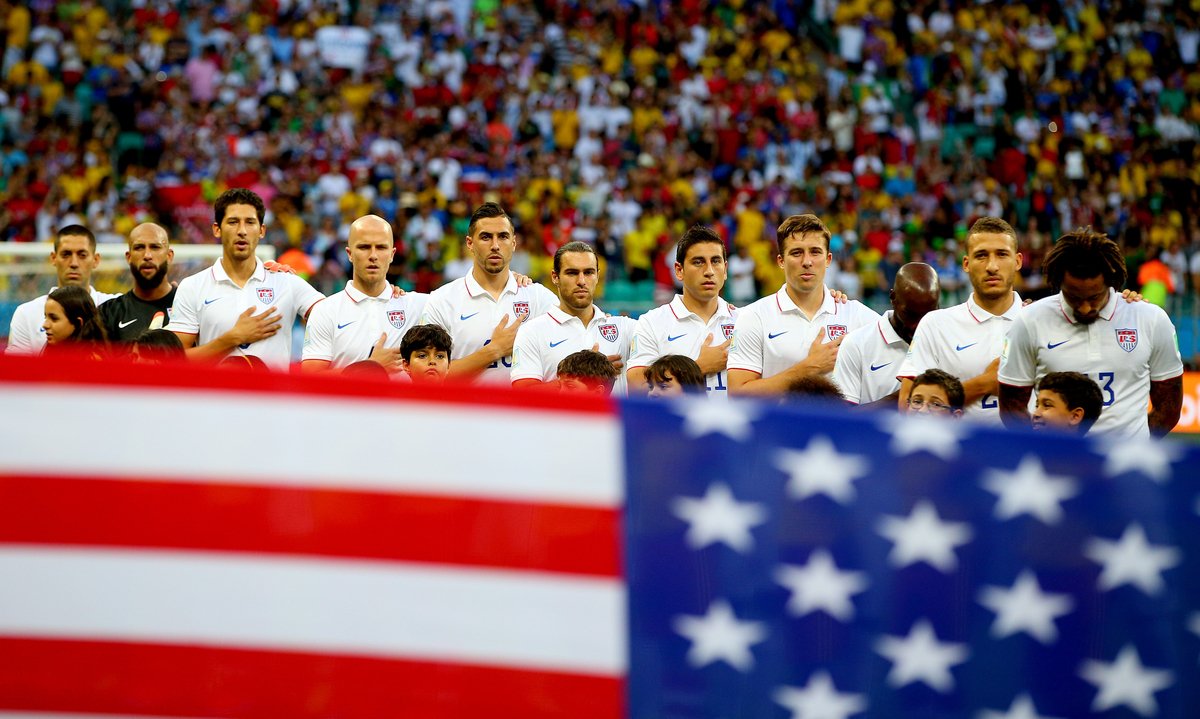 American soccer players pledging to the flag