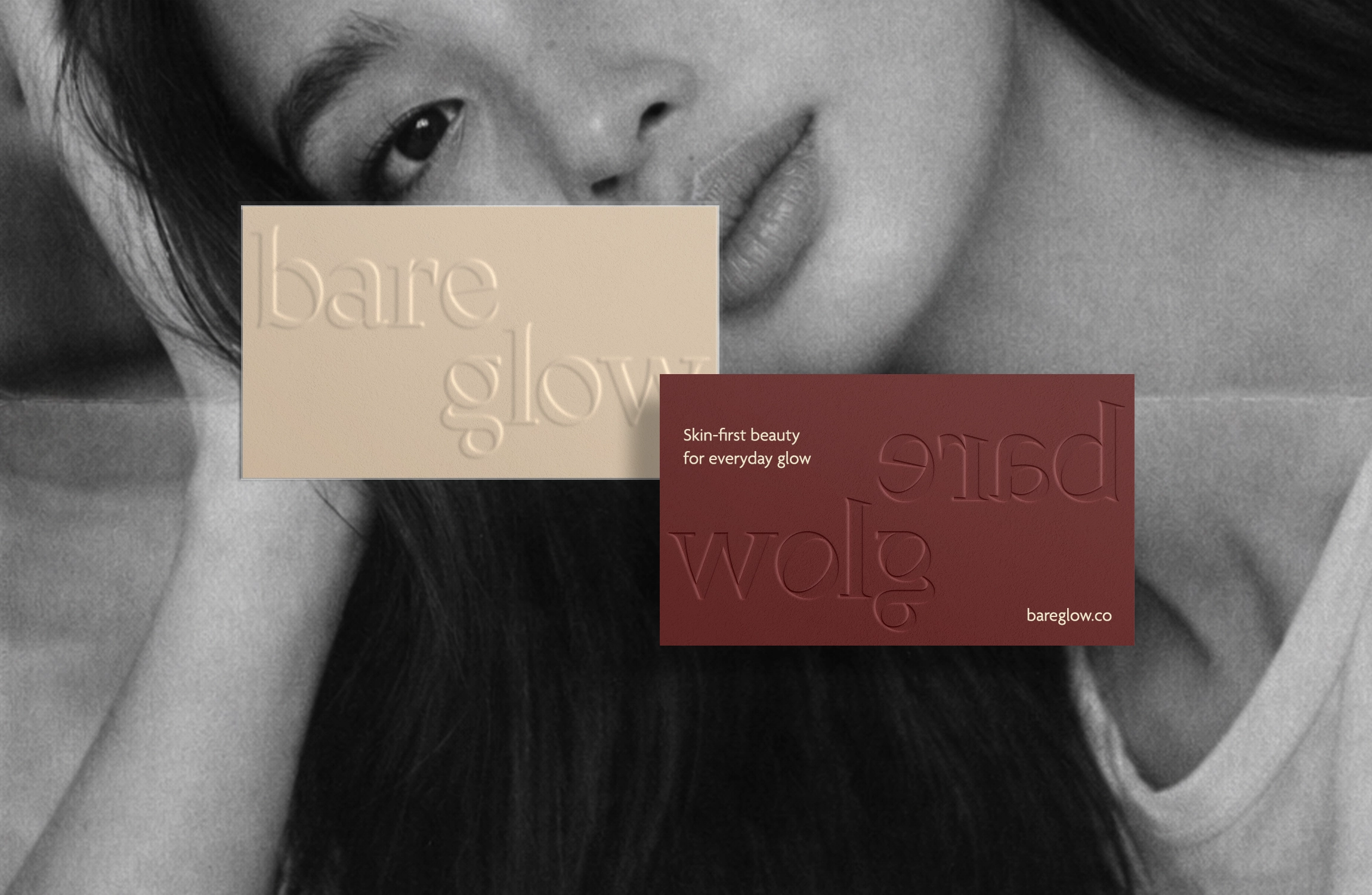 Bare Glow brand identity — business card front and back with embossed logo on model image as background