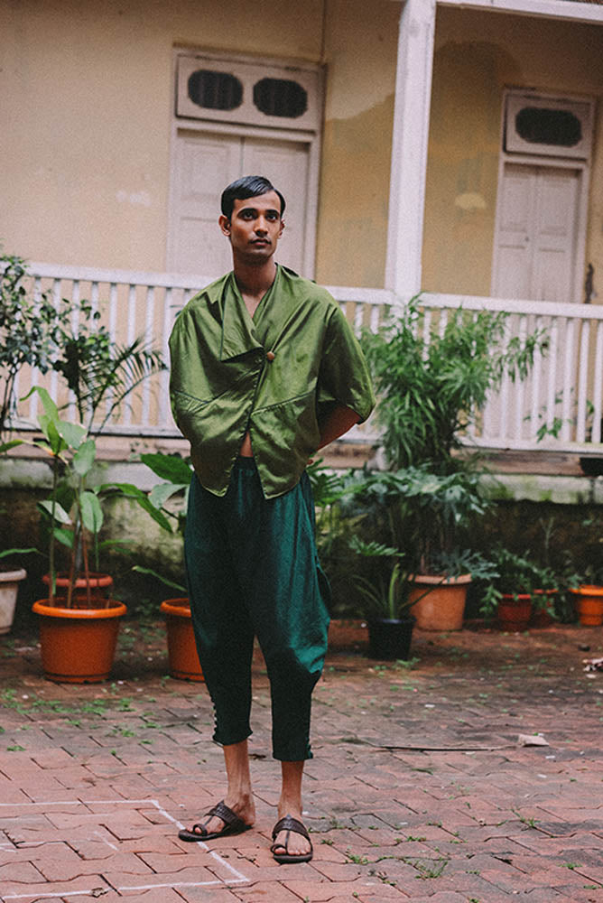 Paunji reimagined dhoti pants with tapered hem and fabric button ankle detail.