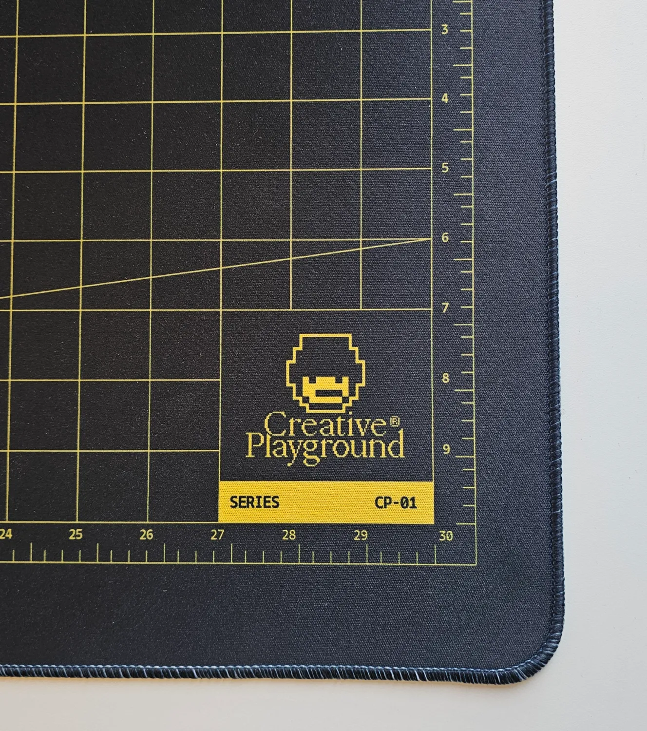 Close-up of the printed Series CP-01 tag on the black mat