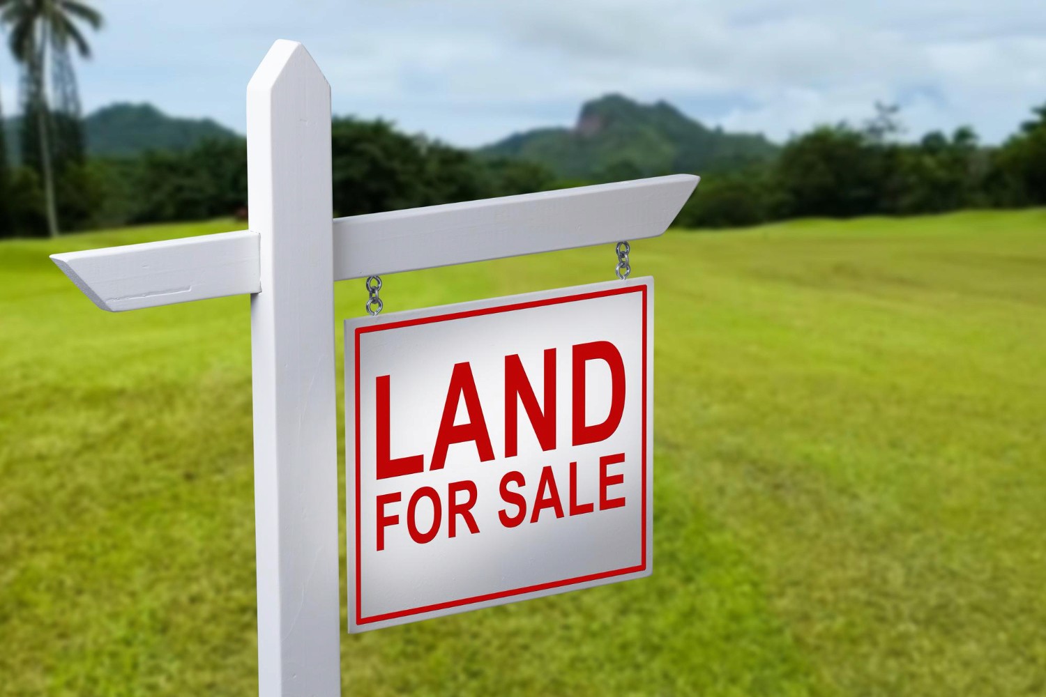farm land with for sale sign
