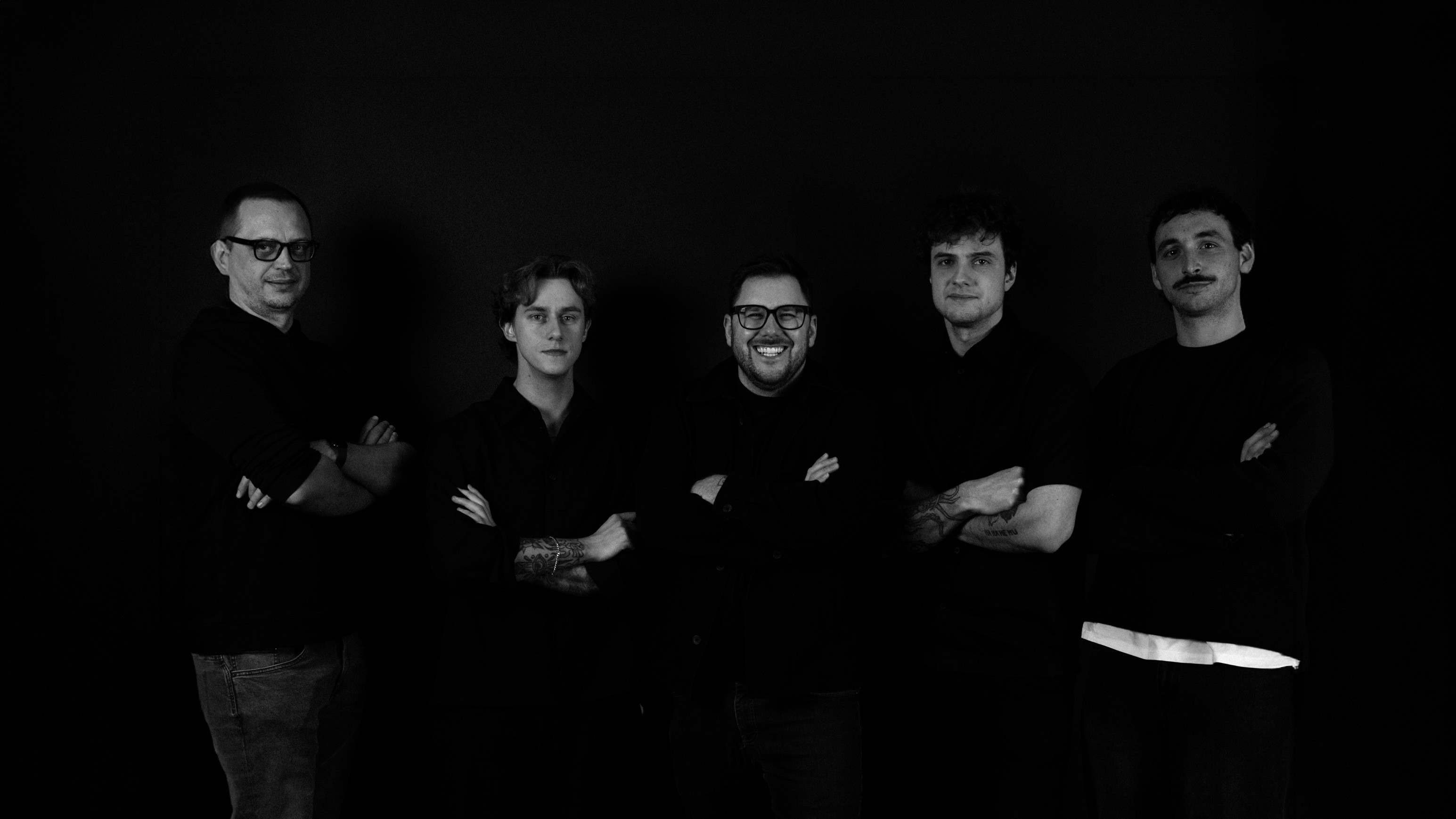 People celebrating, red stickers floating in the air