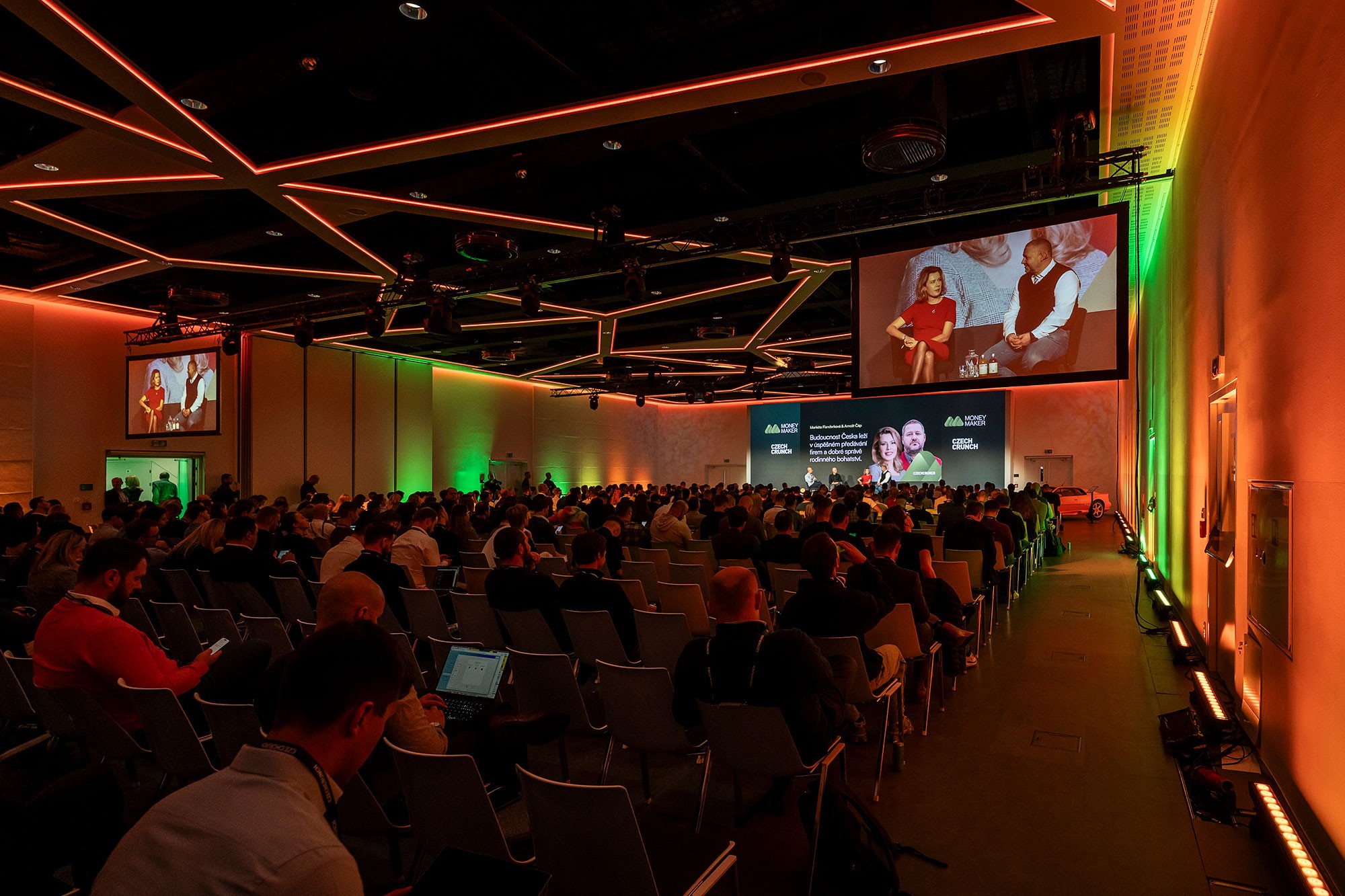 Full auditorium during Money Maker 2024 business conference in Prague with main stage, speakers and audience