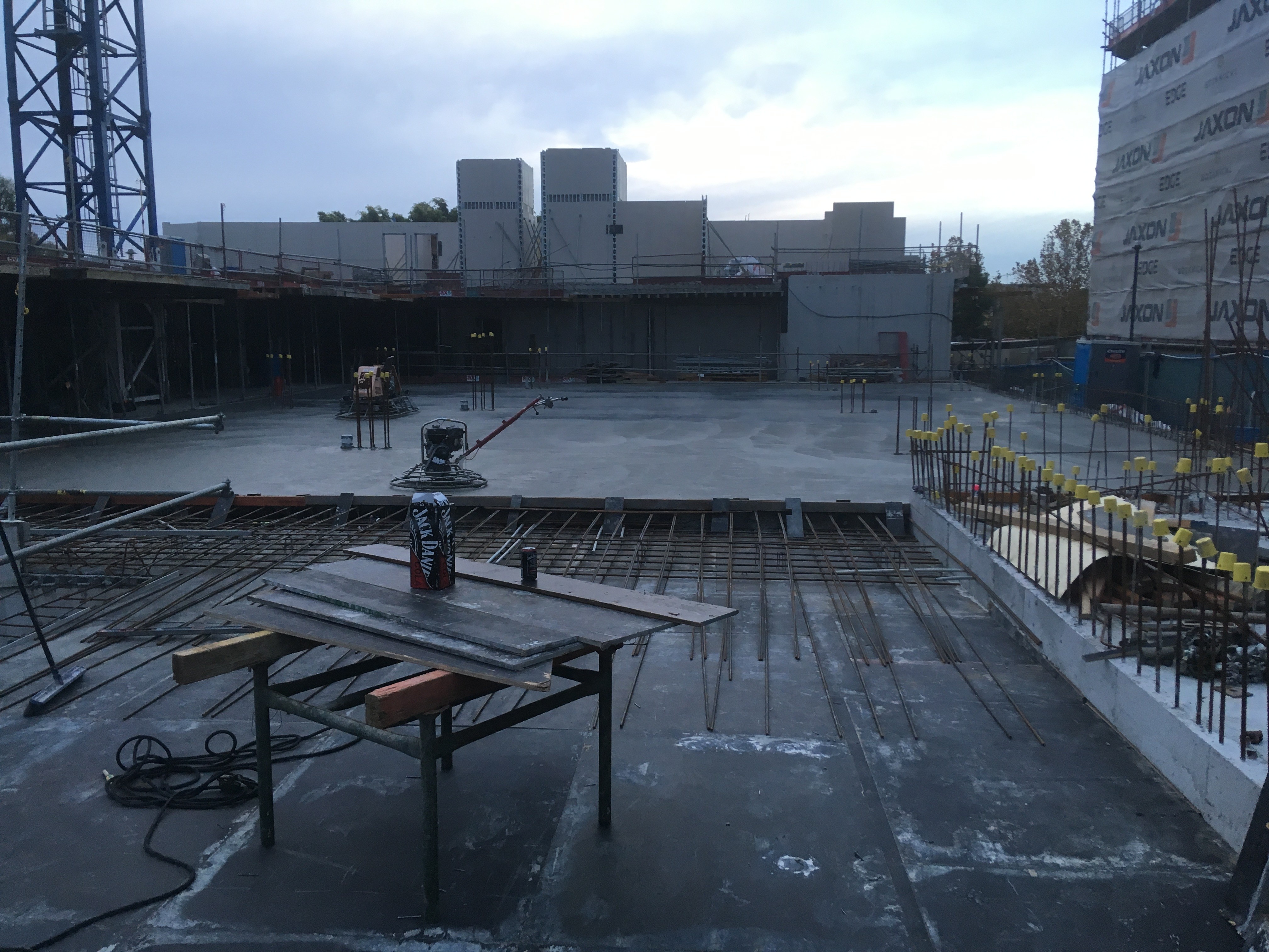 Rachel, personal trainer, looking to the side confidently in a fitness studio