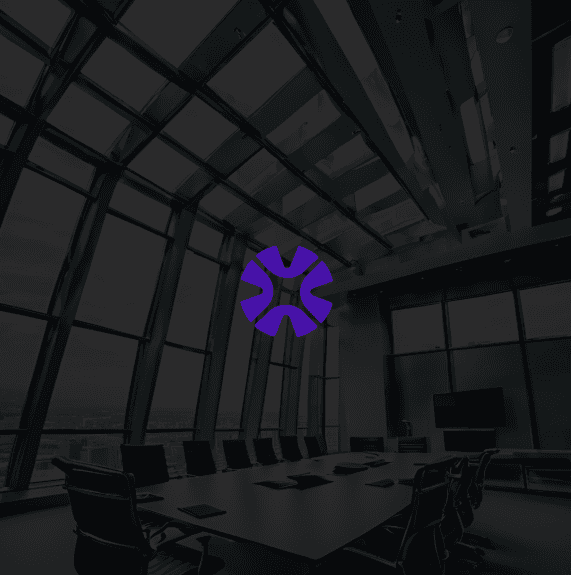 Close-up of a tree stump showing growth rings and a textured brown wood surface.