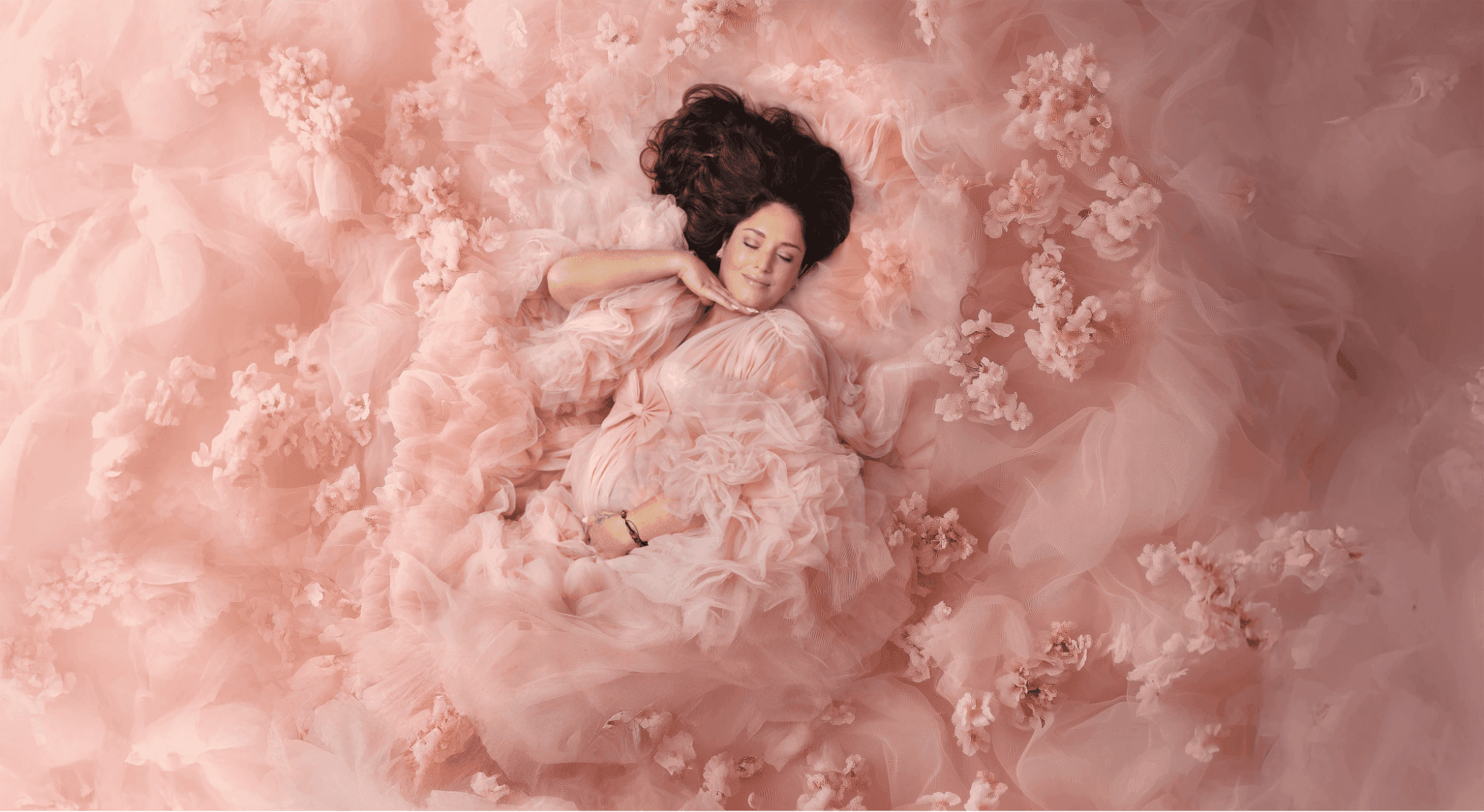 Soft, intimate pregnancy photoshoot of a lying mother-to-be, photographed by Mahvin Photography, Dubai.