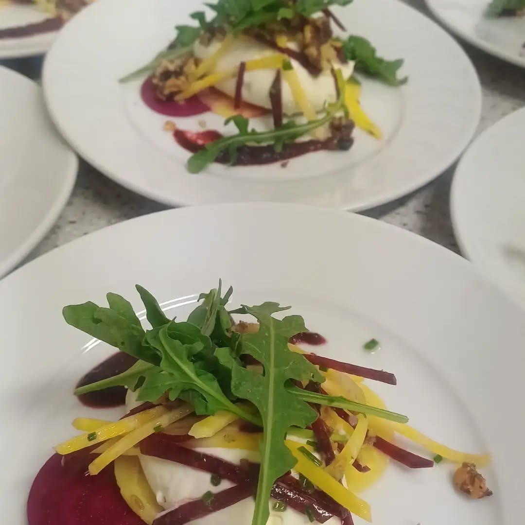 A plated salad prepared by Brown Goose Catering