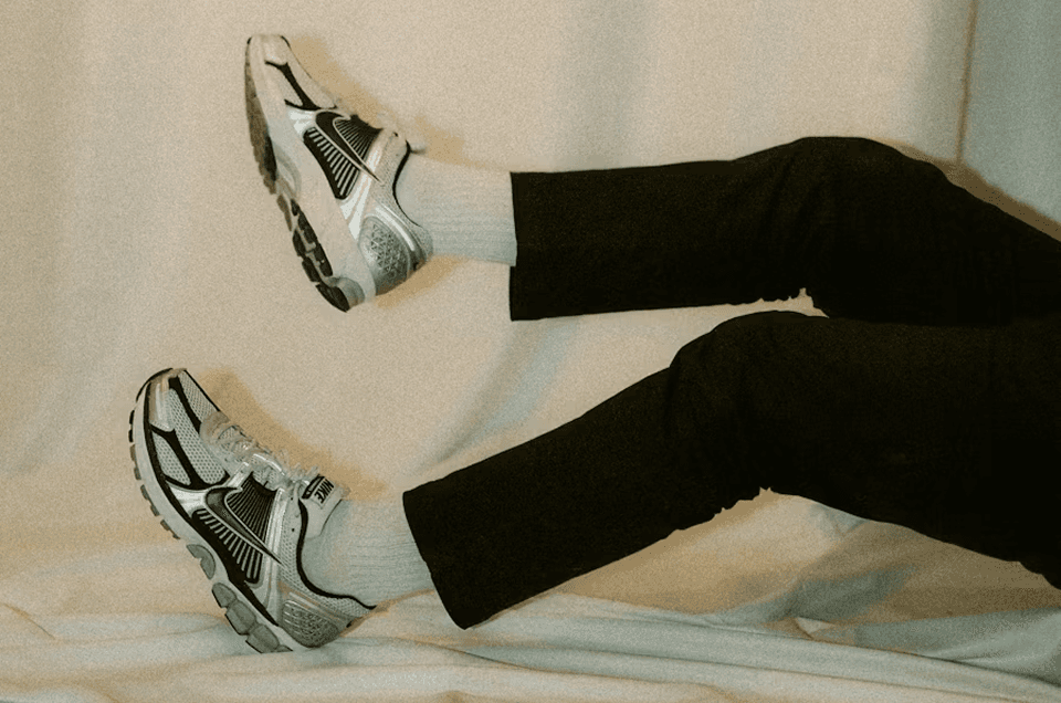 Rows of empty green stadium seats viewed from above, forming a repeating pattern — representing scale, audience reach, and how strong B2B brand impact is built by engaging the right accounts at scale rather than everyone at once.