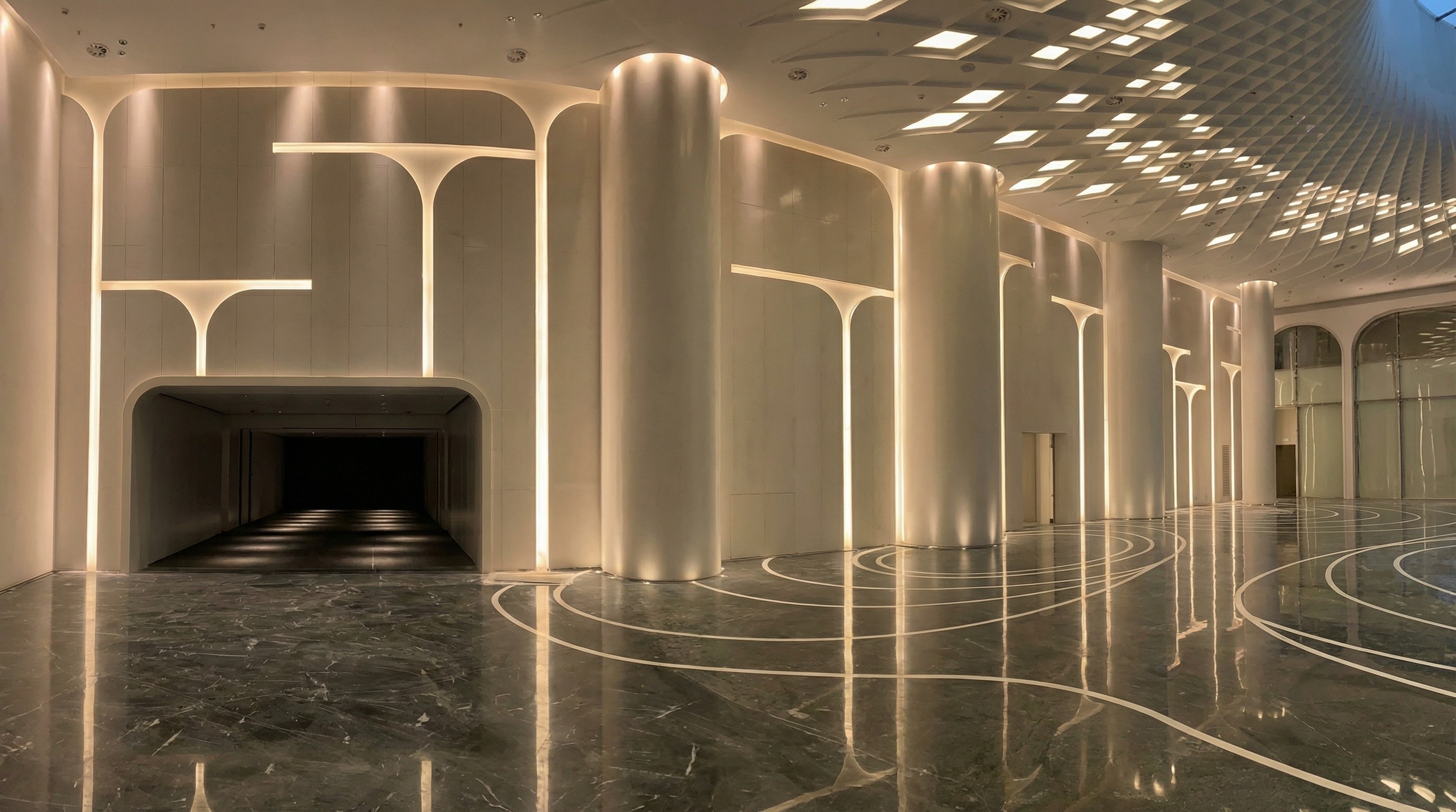 Grand subway station lobby with artistic marble floor inlays and glowing architectural stone columns by NOVA STONE.