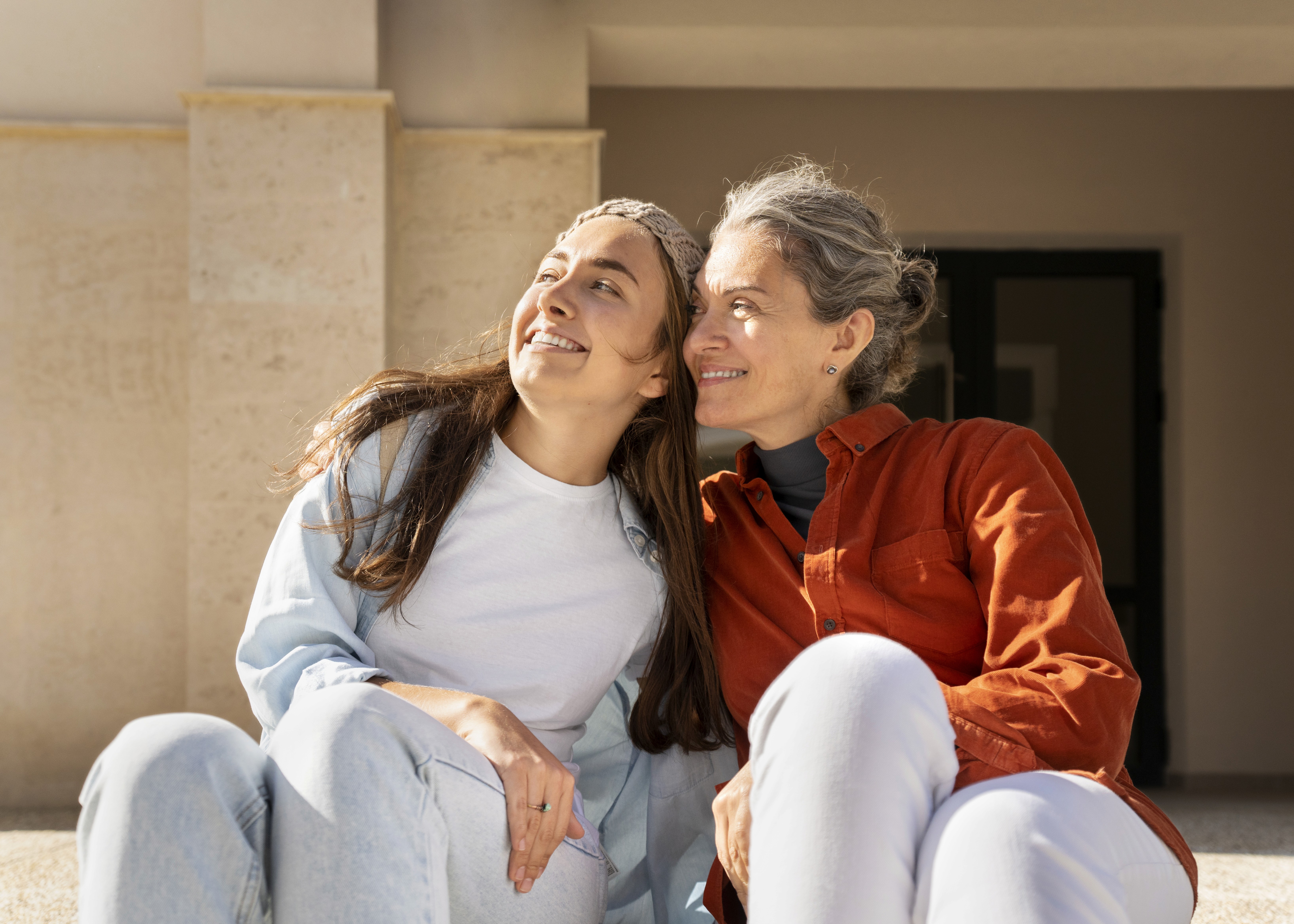 mother and daughter sitting