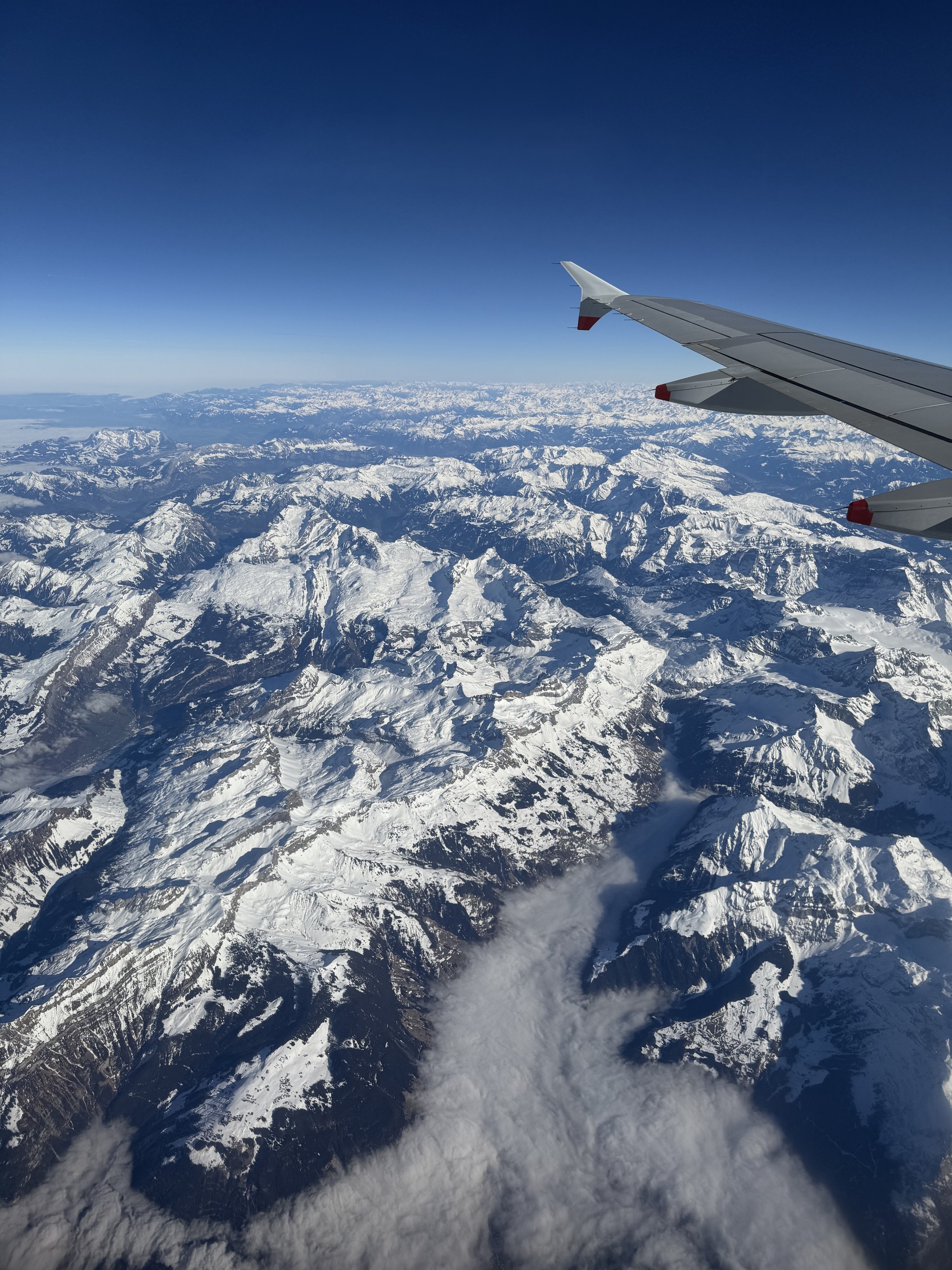 Image of the Alps from 30,000 with clear blue skies.