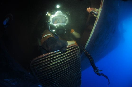 photography of two persons underwater